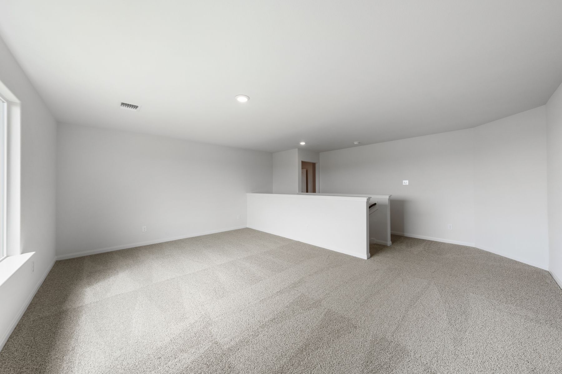 The spacious upstairs loft is the perfect space for a gameroom or craft room.