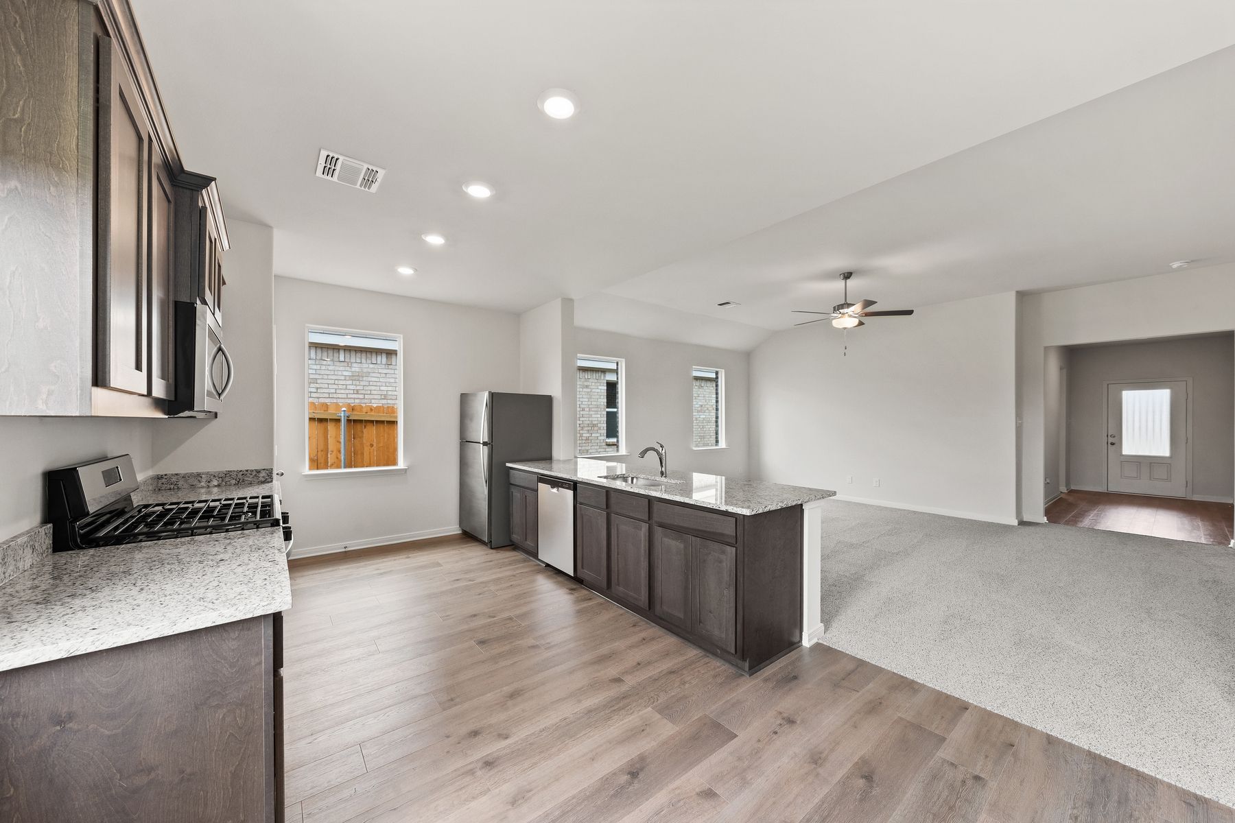 The kitchen has sprawling granite countertops.