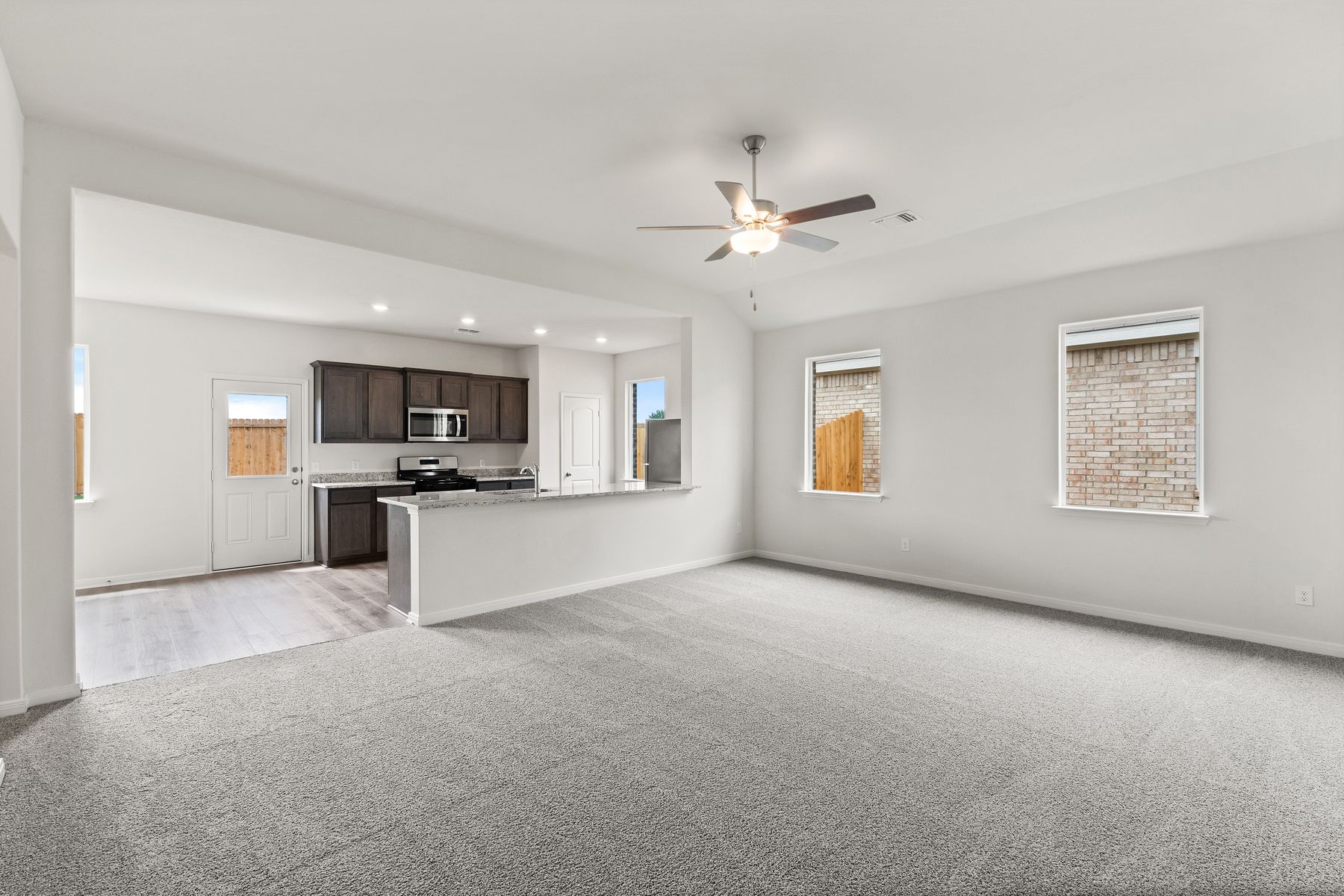 The open layout connects the family room with the kitchen and dining room.