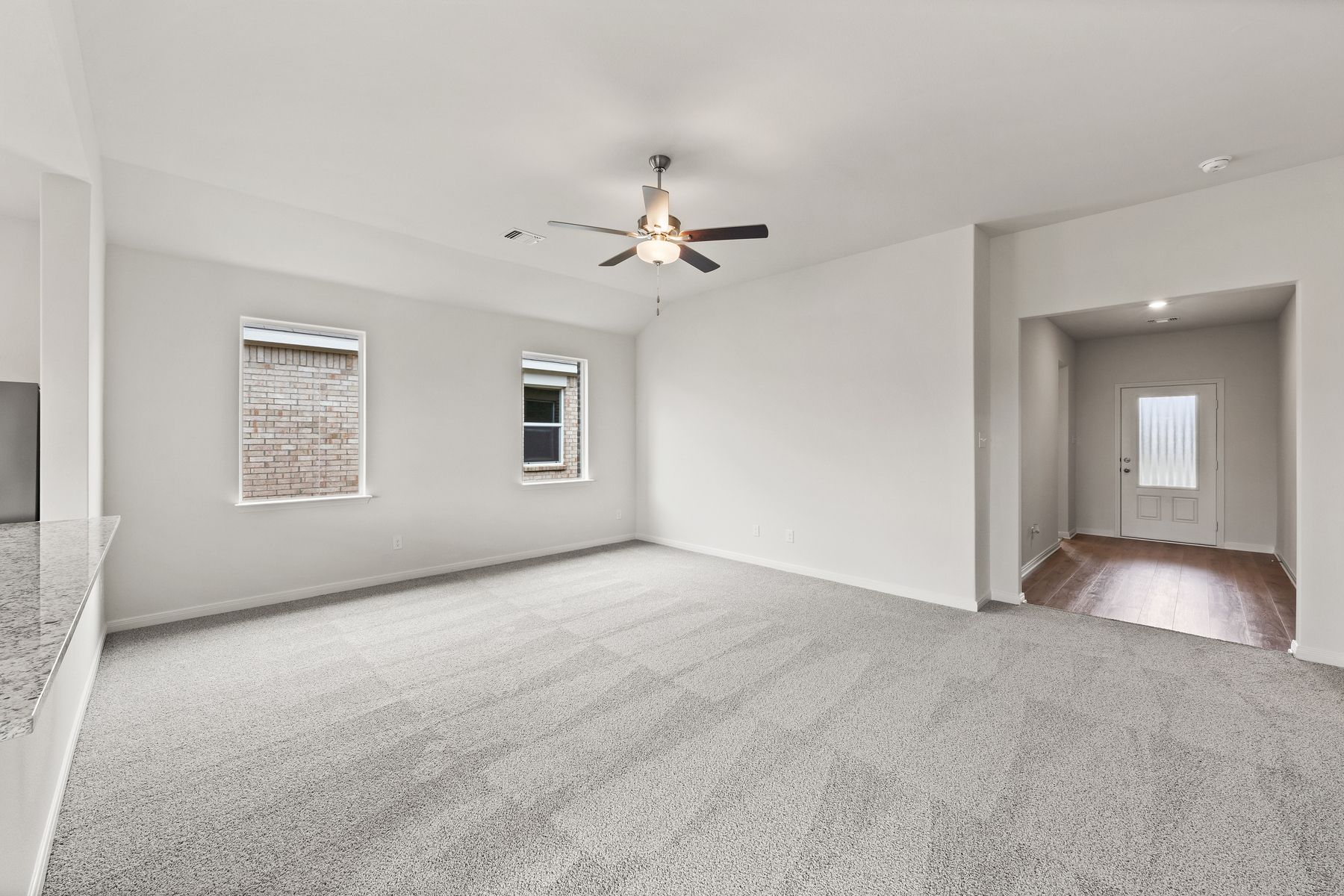 The spacious family room is perfect for family living and hosting.