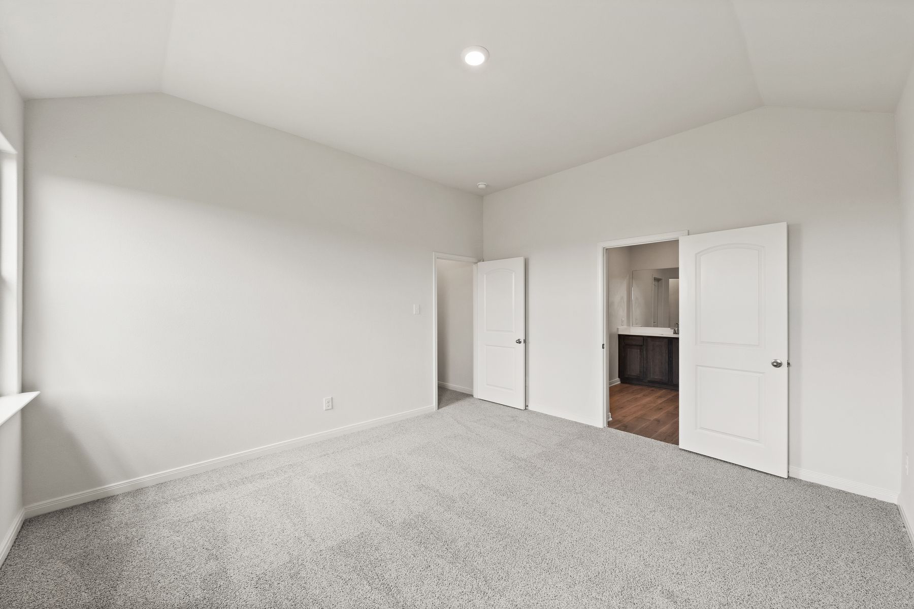 The master suite has a spacious bedroom, en-suite bathroom and walk-in closet.