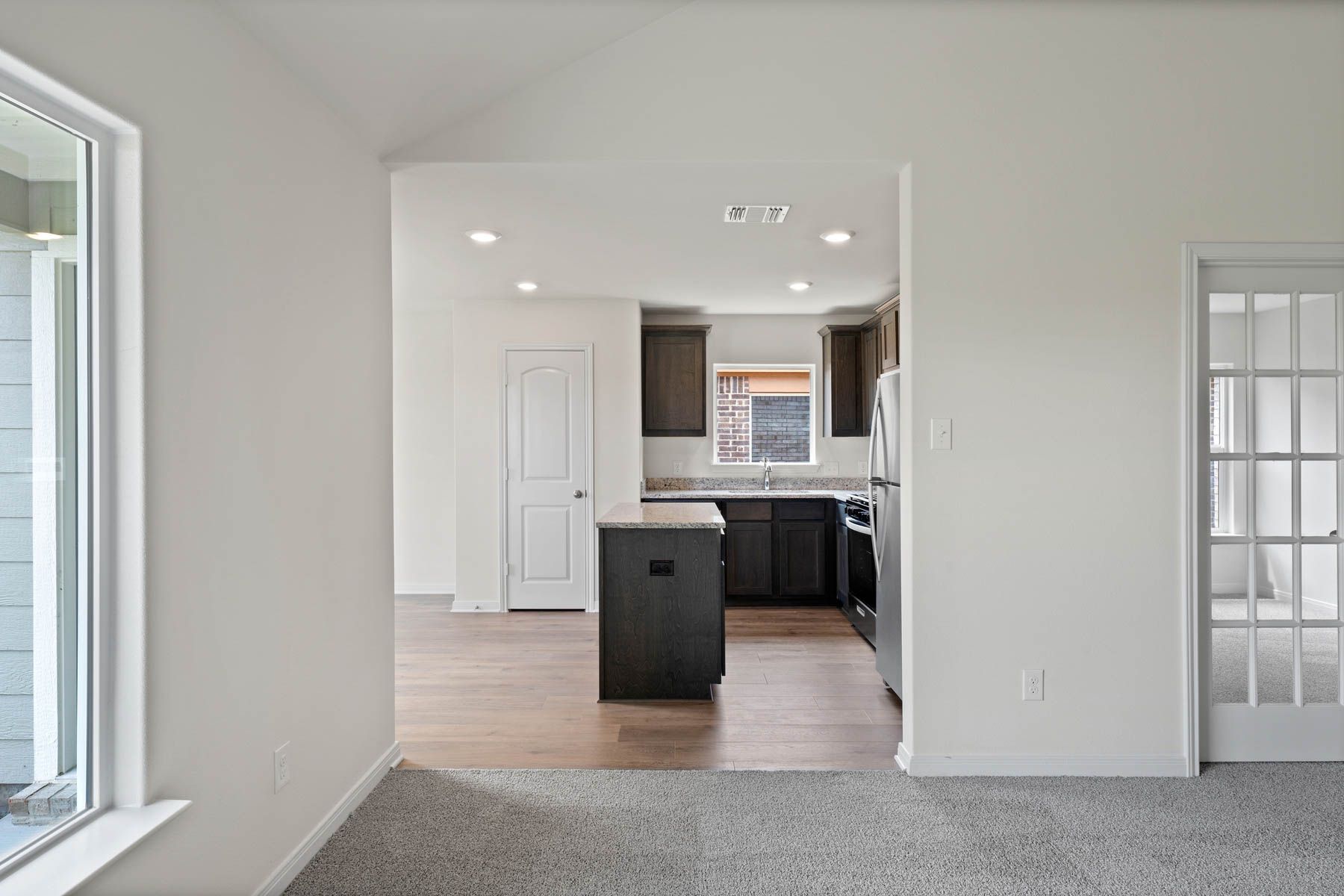 The open layout connects the family room with the kitchen and dining room.