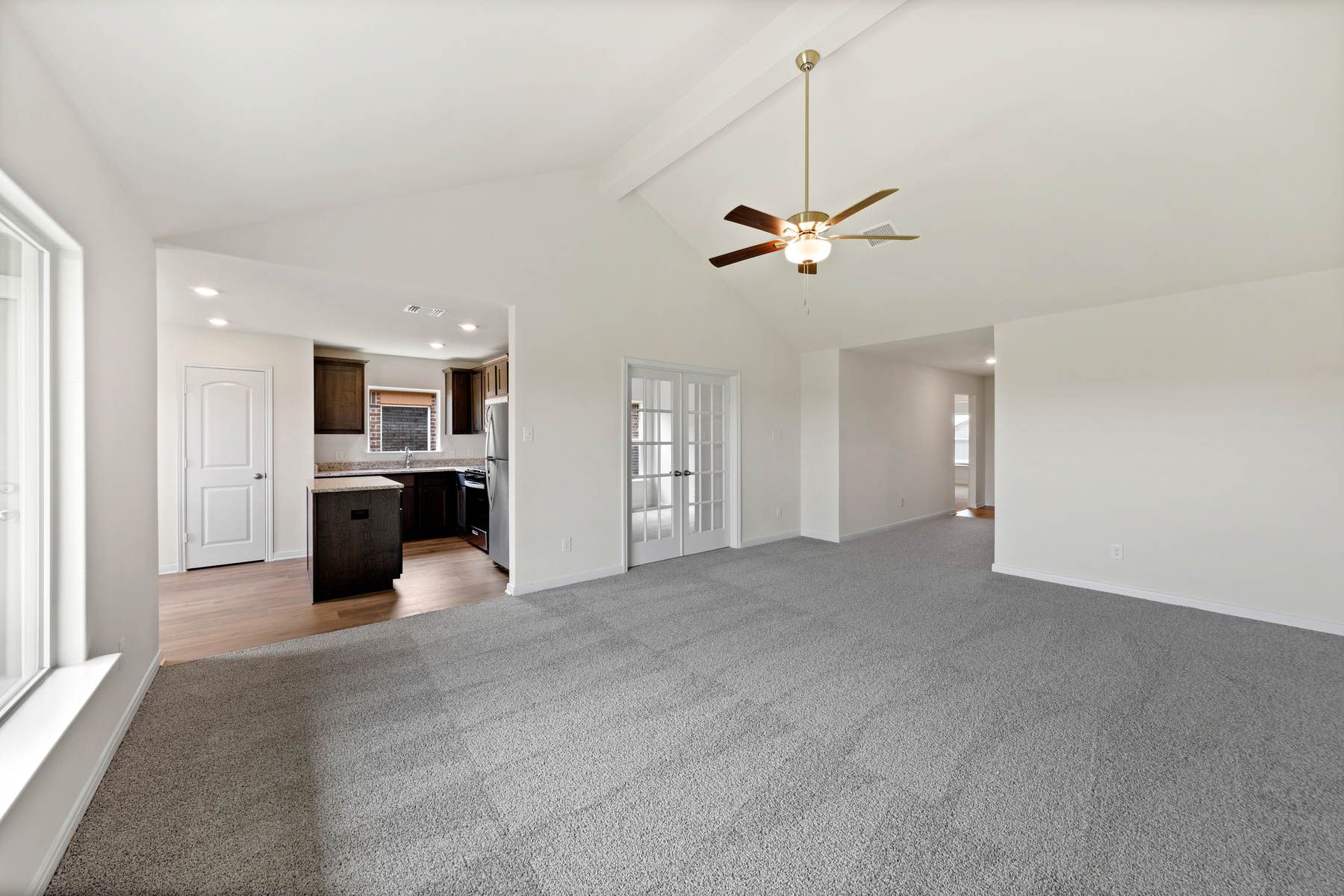 The open layout connects the family room with the kitchen and dining room.