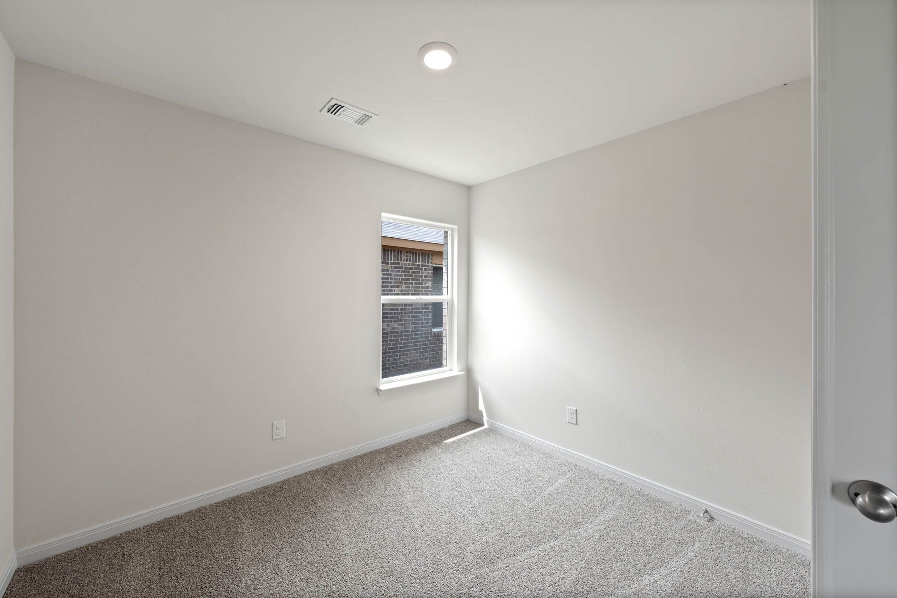 The flex room sits off of the family room and is a great space for an at-home office or guest room.