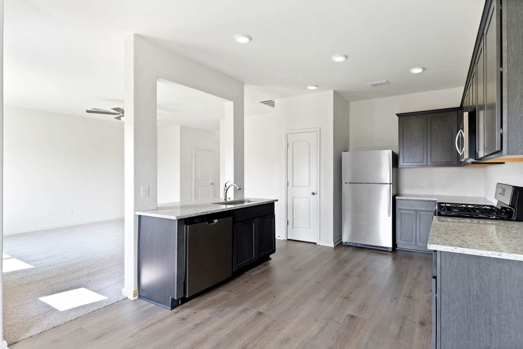 The kitchen has sprawling granite countertops.
