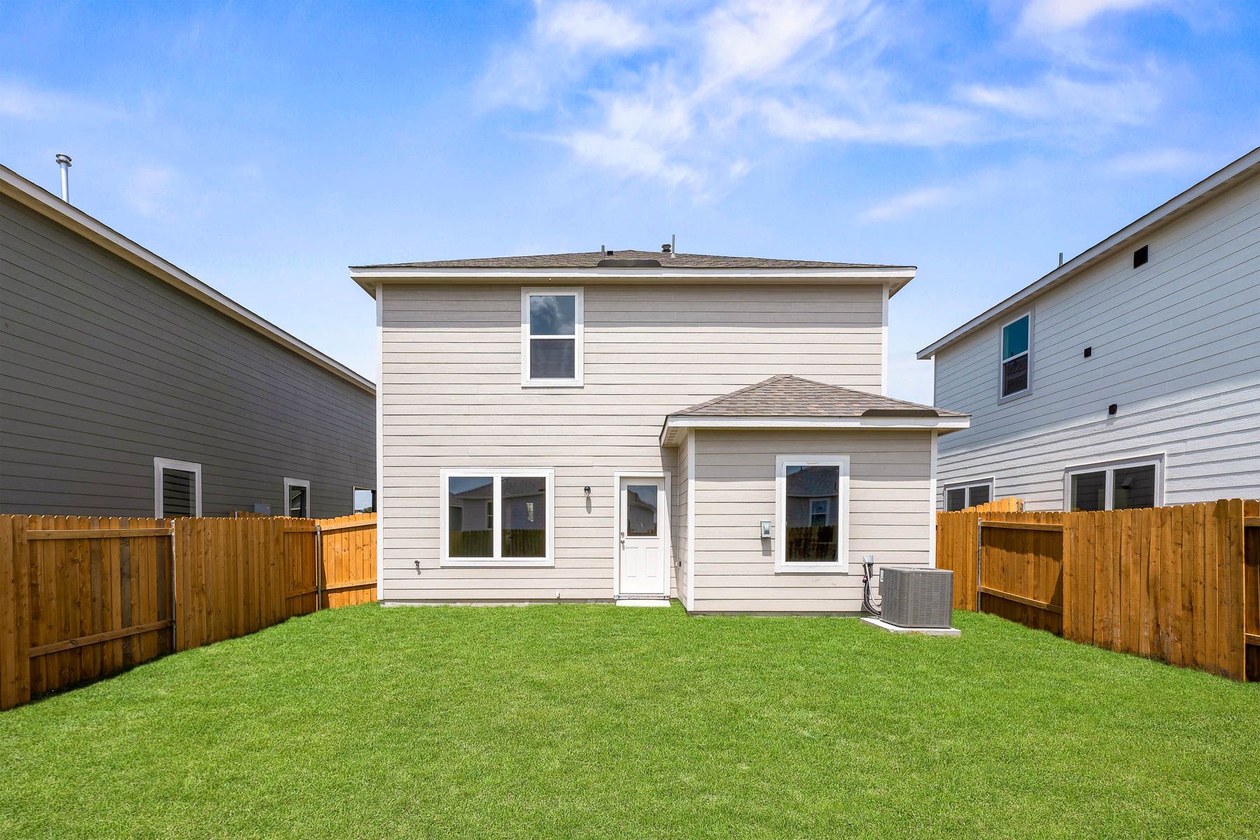 The back yard of the Colorado plan is fully fenced-in.