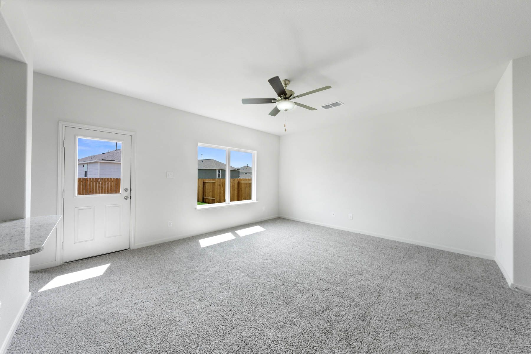 The spacious family room is perfect for family living and hosting.