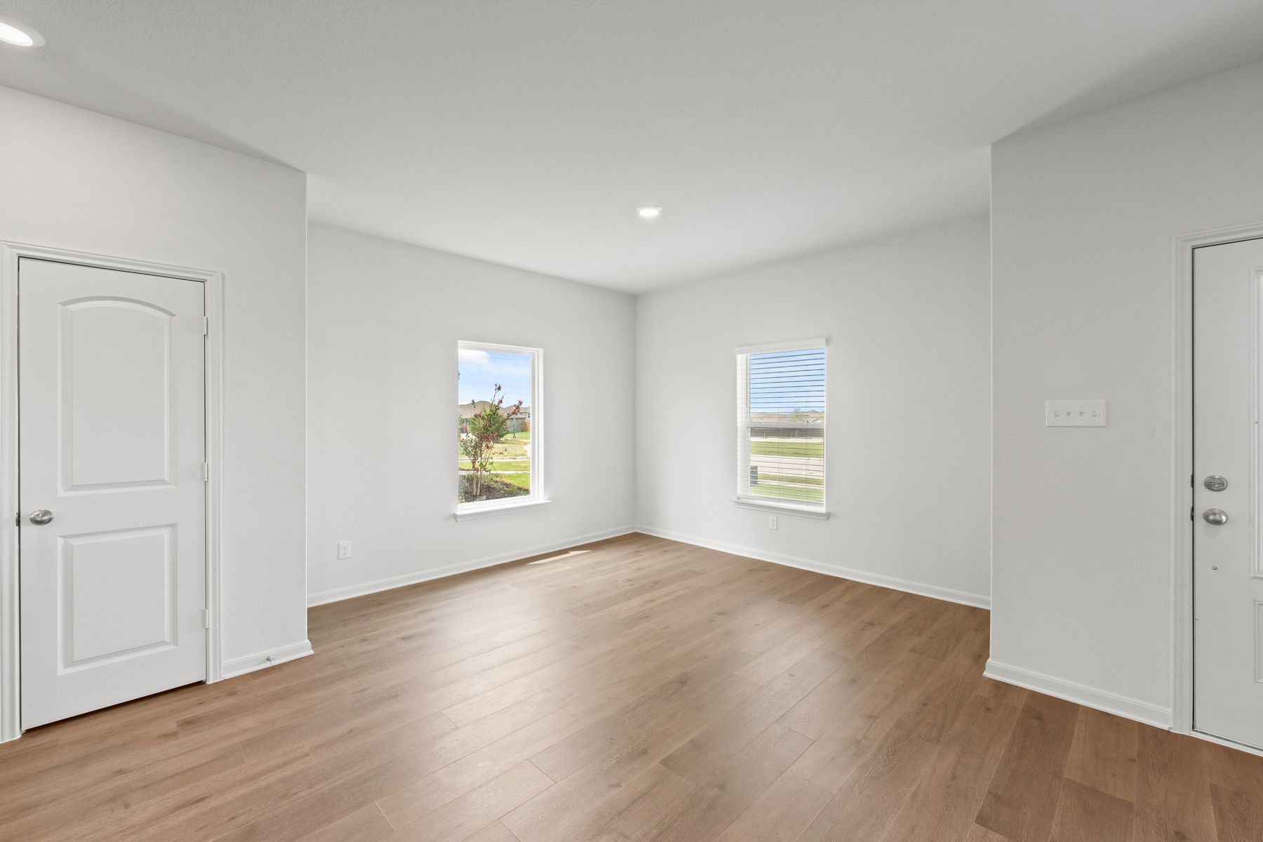 The dining room sits right off of the kitchen and has a large window.