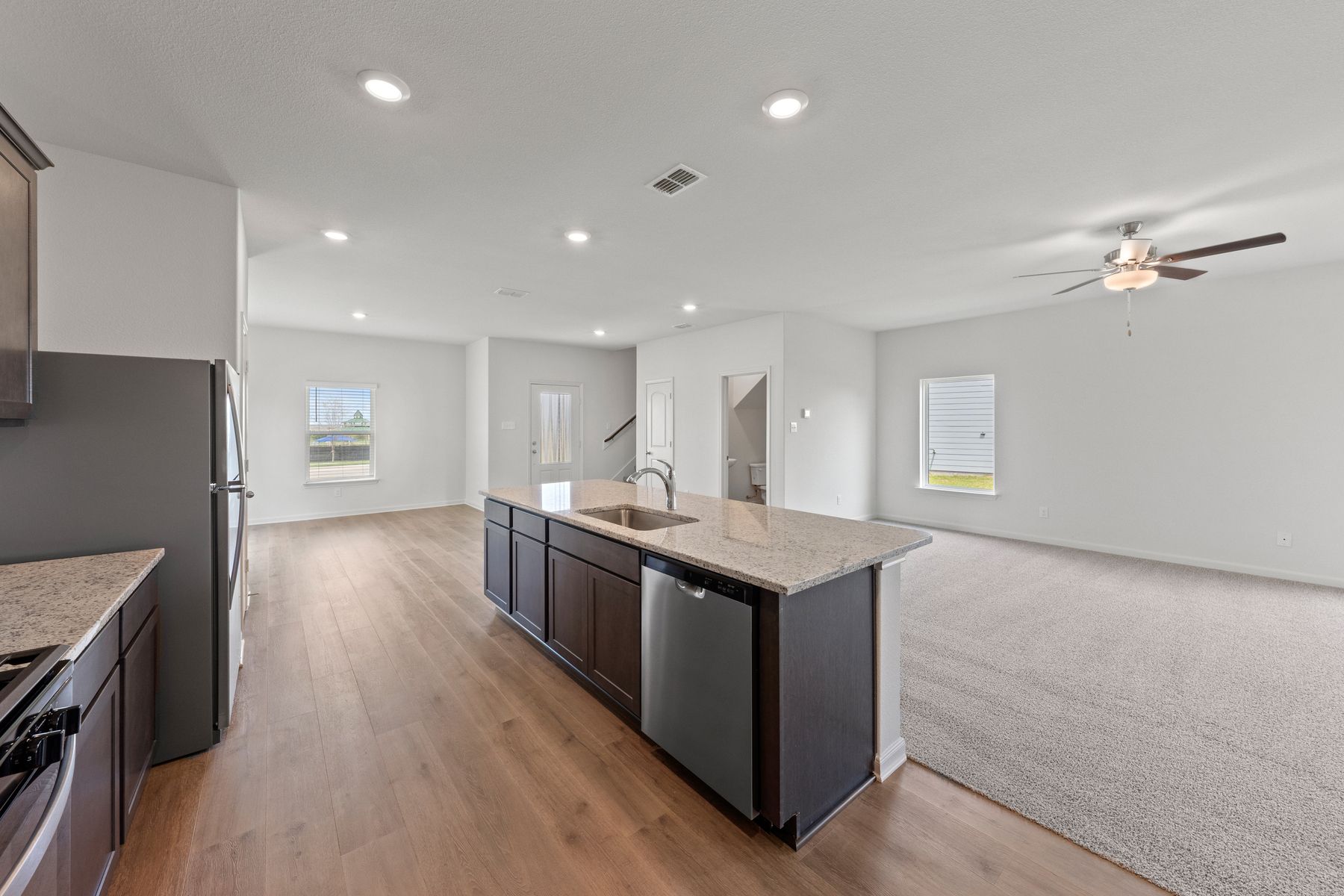 The spacious kitchen has upgraded features that make cooking and cleaning more enjoyable.