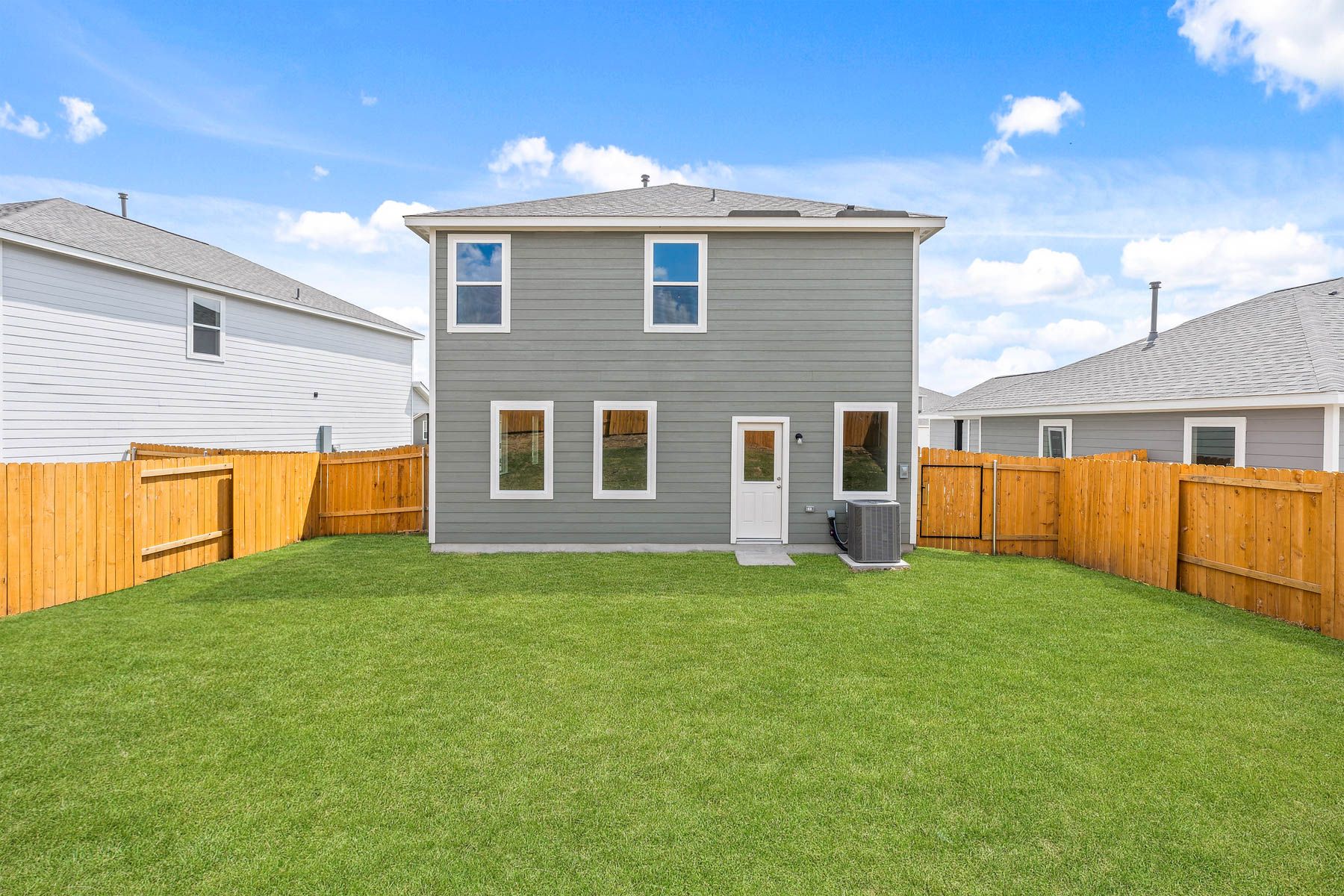 The back yard of the Juniper plan is fully fenced-in.