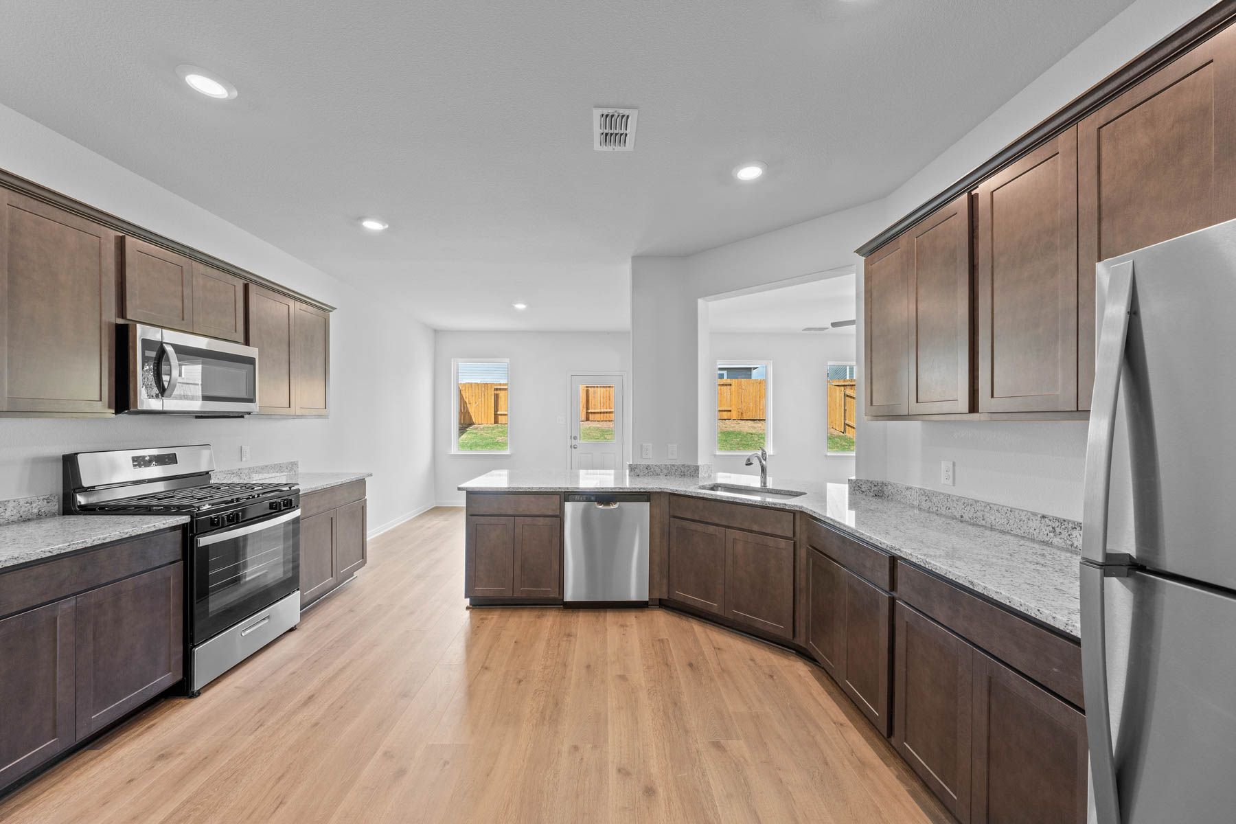 The kitchen has sprawling granite countertops.