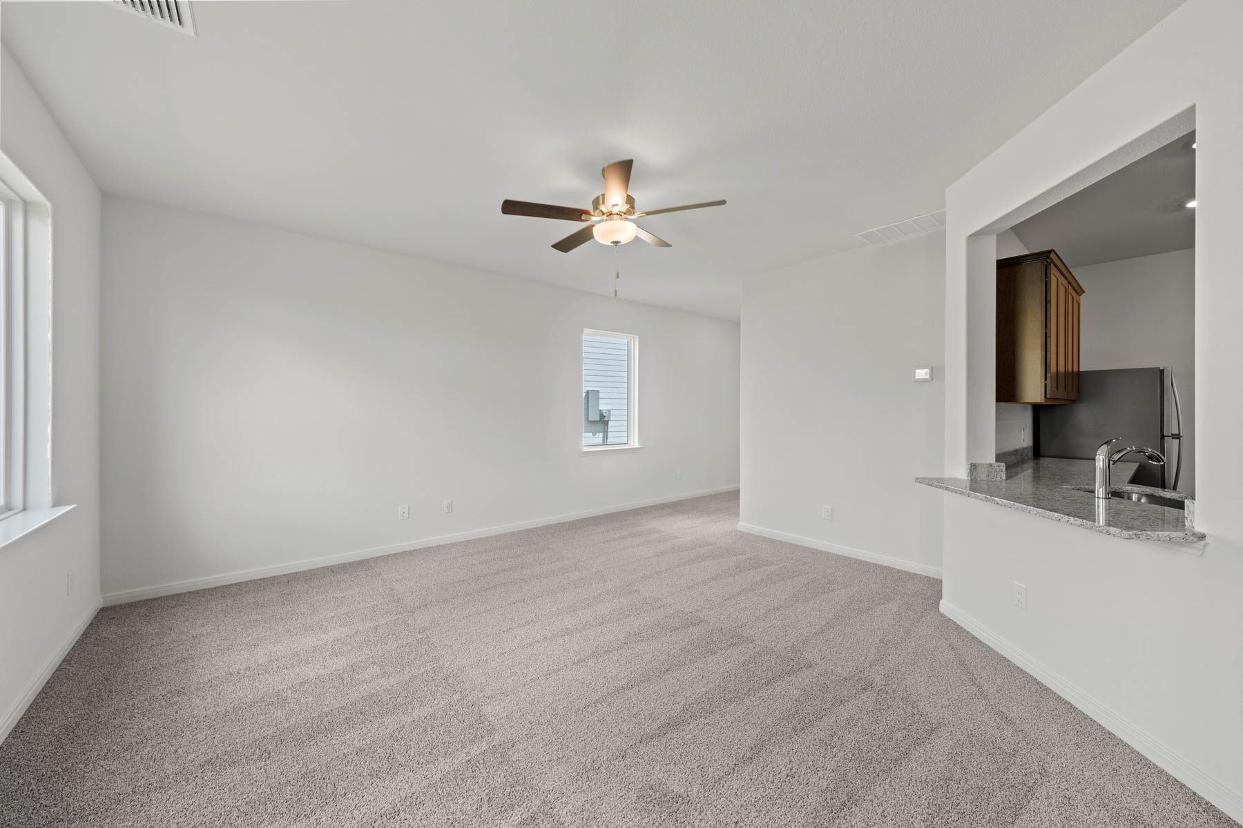 The spacious family room is perfect for family living and hosting.