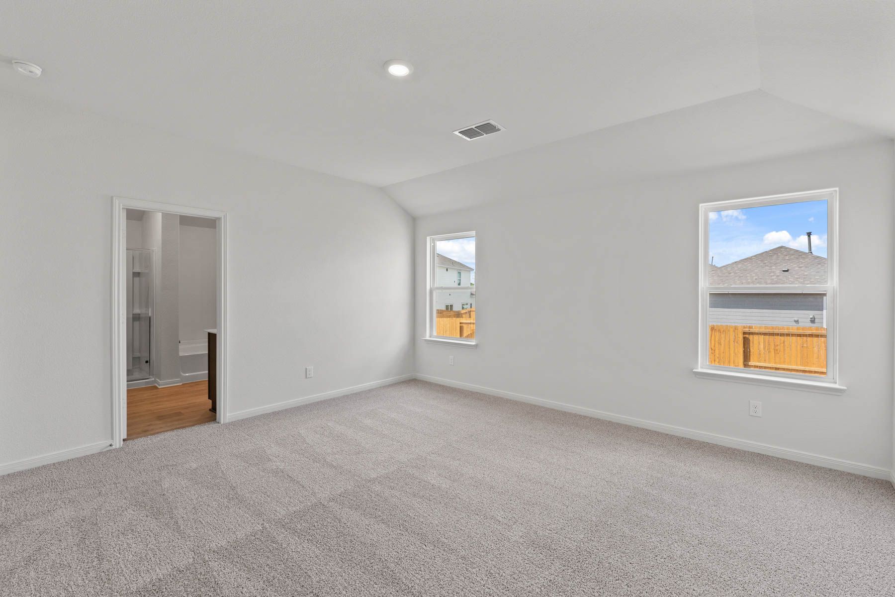 The master suite has a spacious bedroom, en-suite bathroom and walk-in closet.