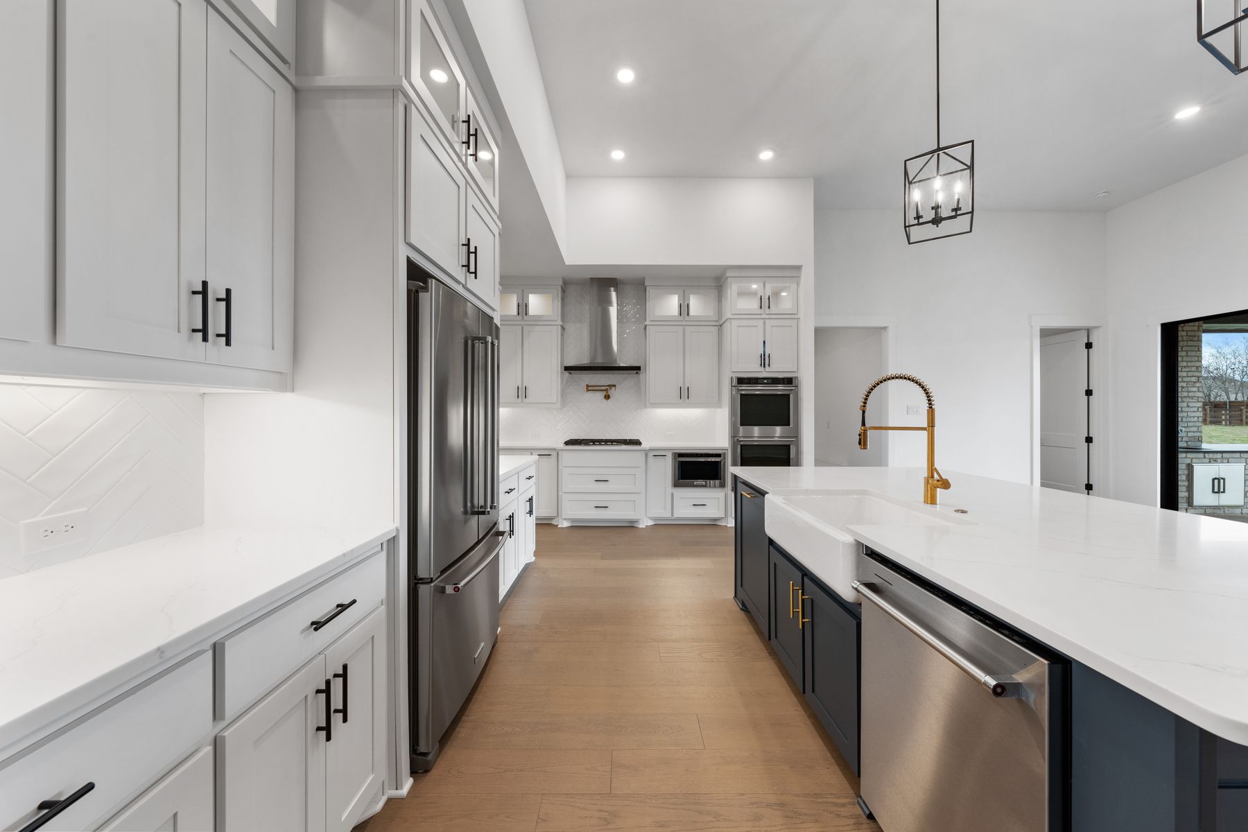 The kitchen has stainless-steel KitchenAid appliances.