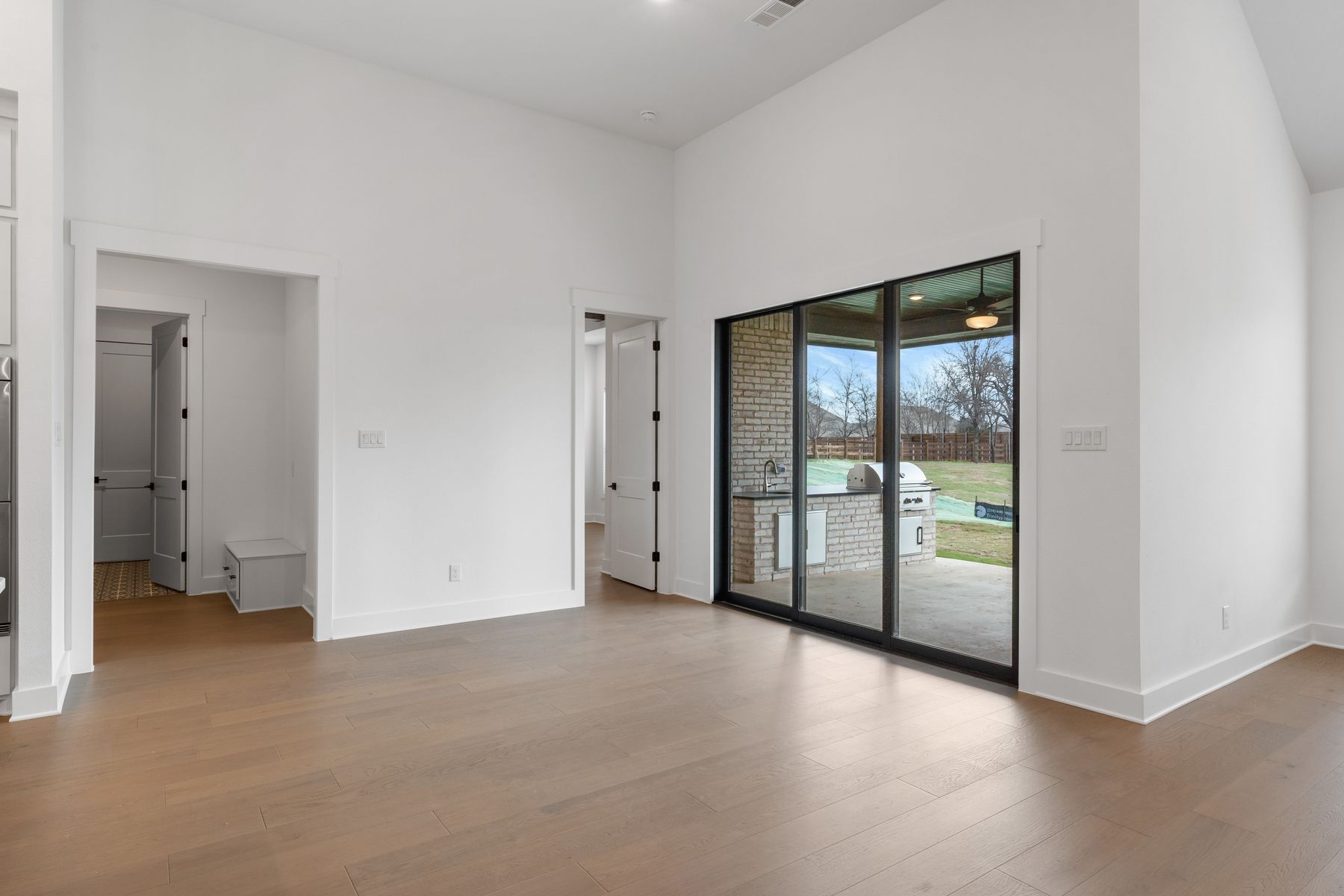 The open breakfast area has plenty of natural light from the sliding back doors.
