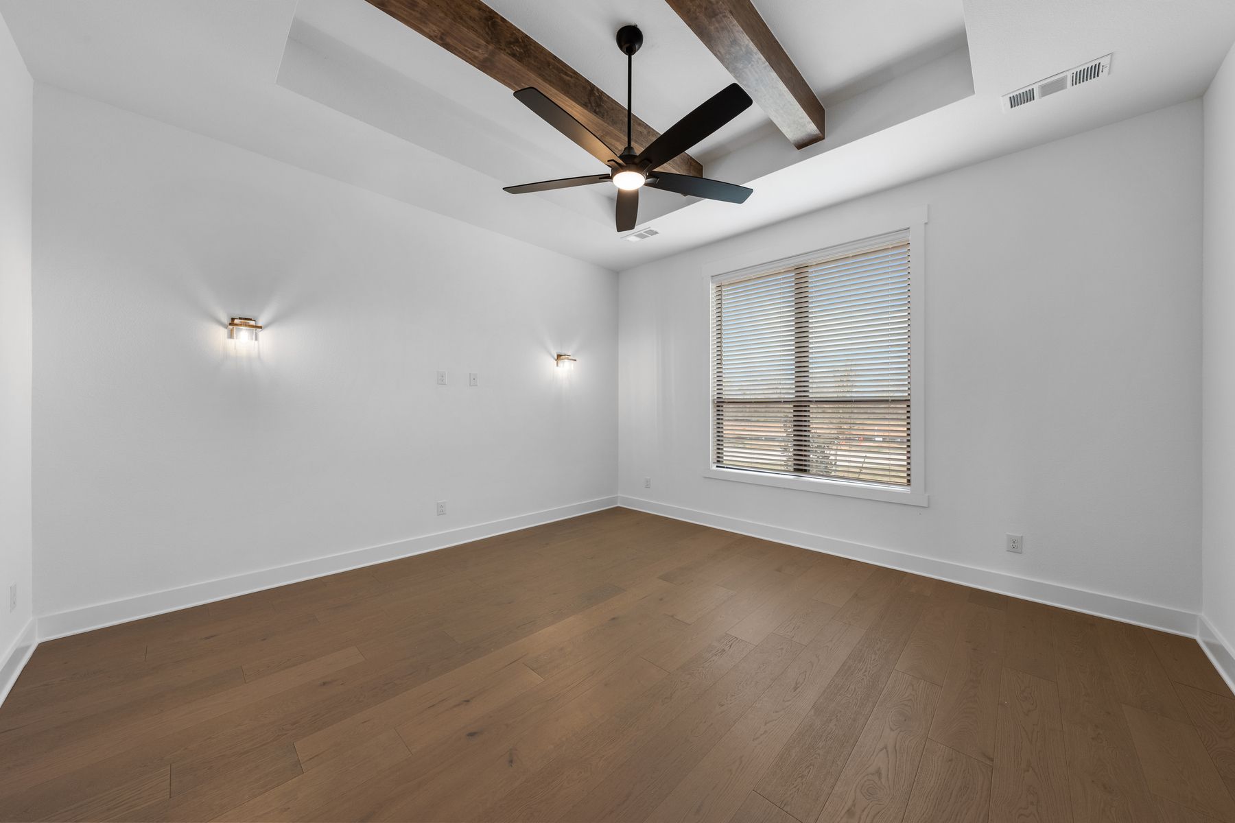 The gameroom is located right off of the foyer and has a large window.