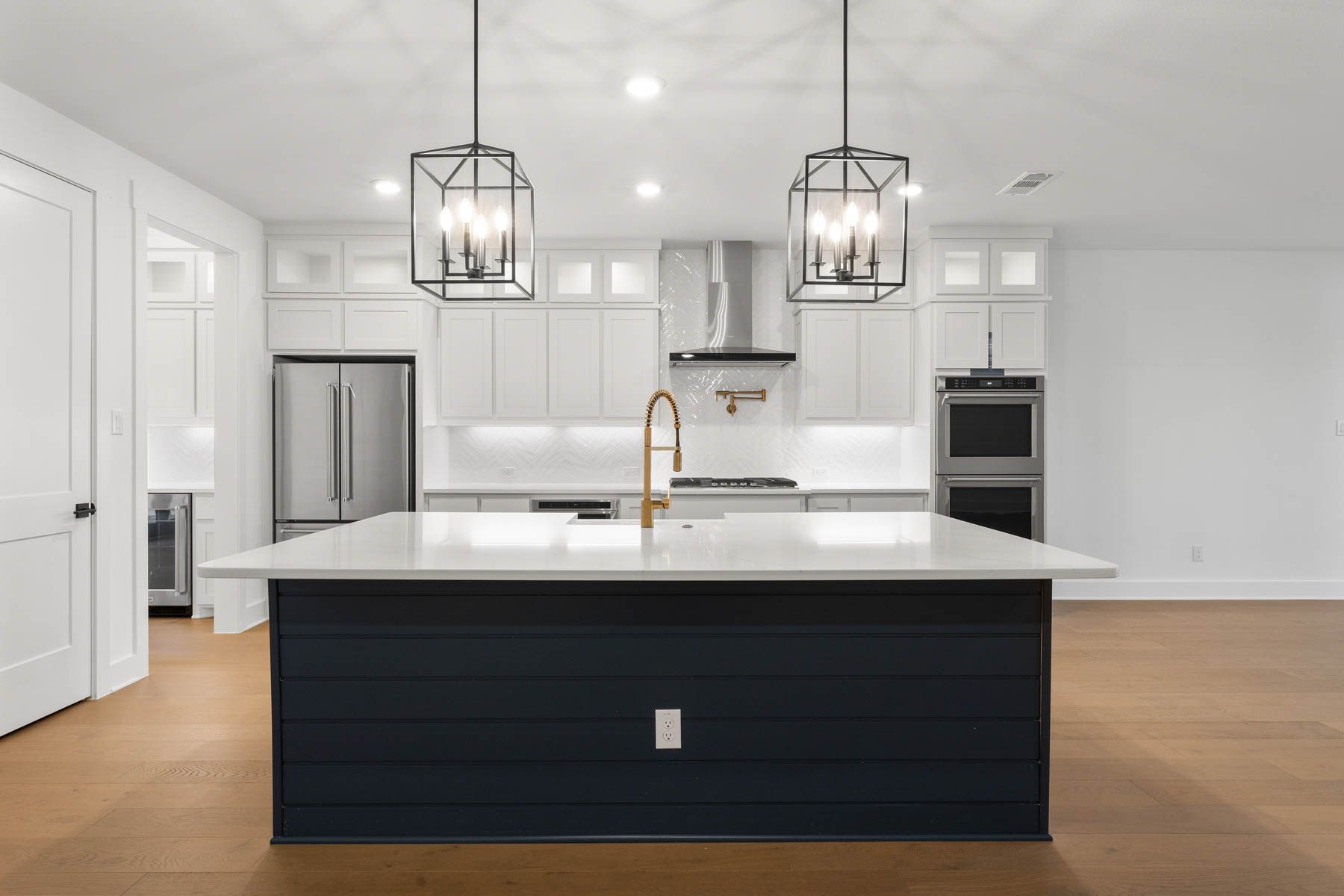The kitchen has gorgeous white cabinetry.