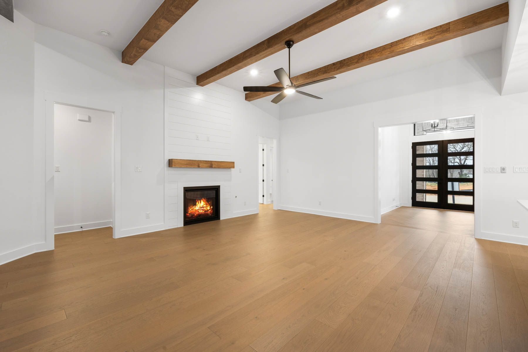 The spacious family room has an electric fireplace.
