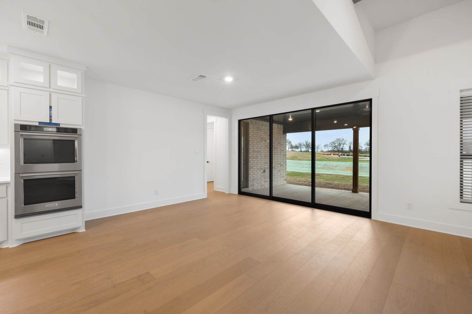 The open breakfast area has plenty of natural light from the sliding back doors.