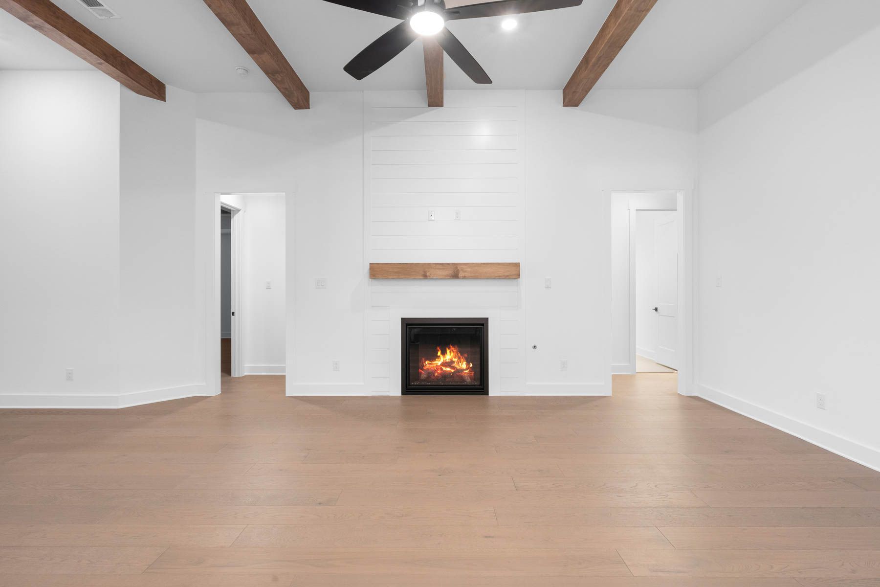 The spacious family room has an electric fireplace.