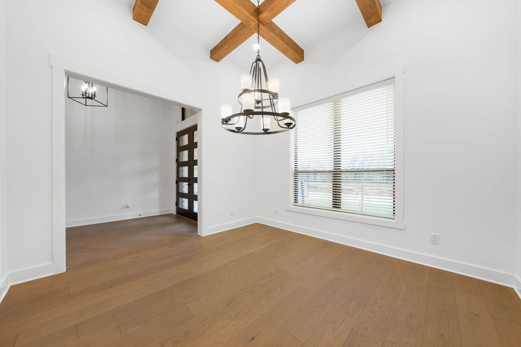 The formal dining room sits right off of the kitchen and has a large window.