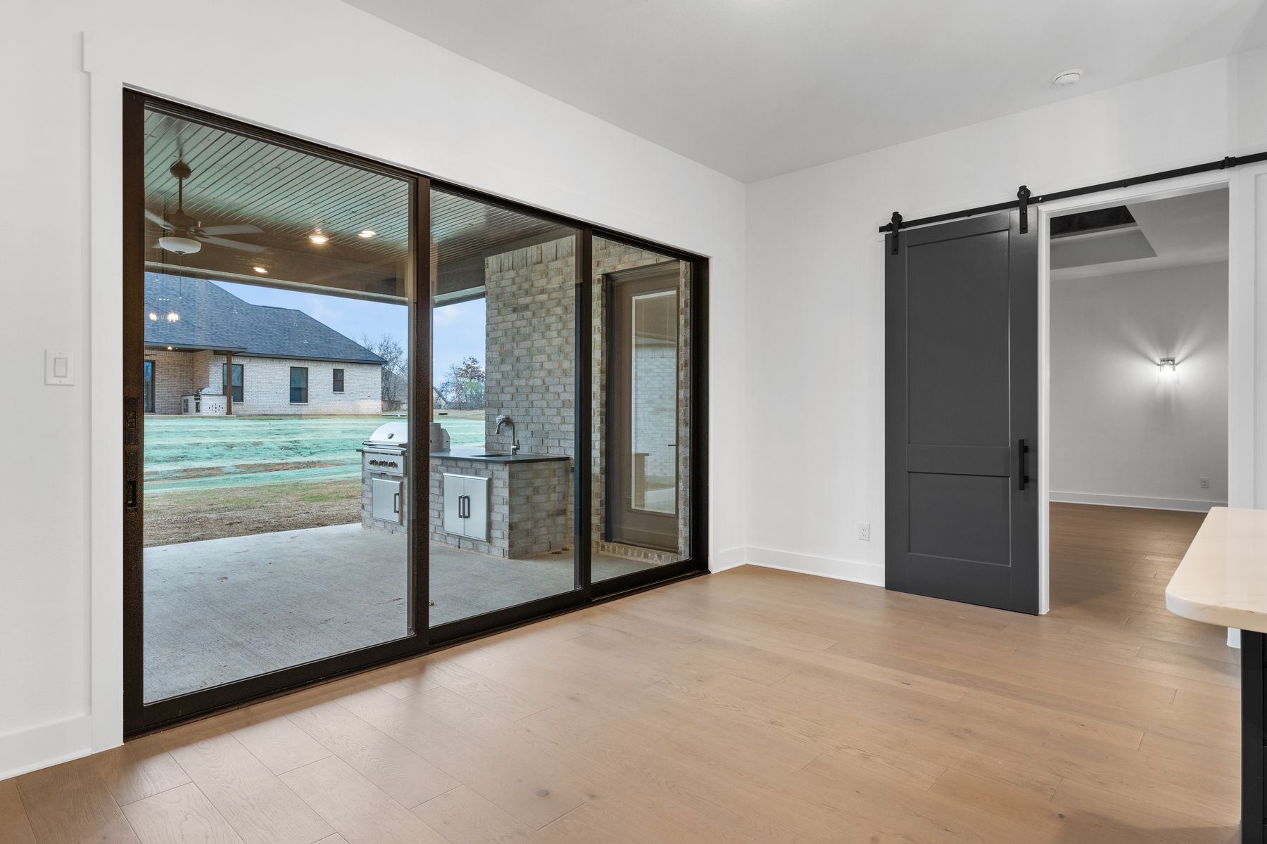 The open breakfast area has plenty of natural light from the sliding back doors.