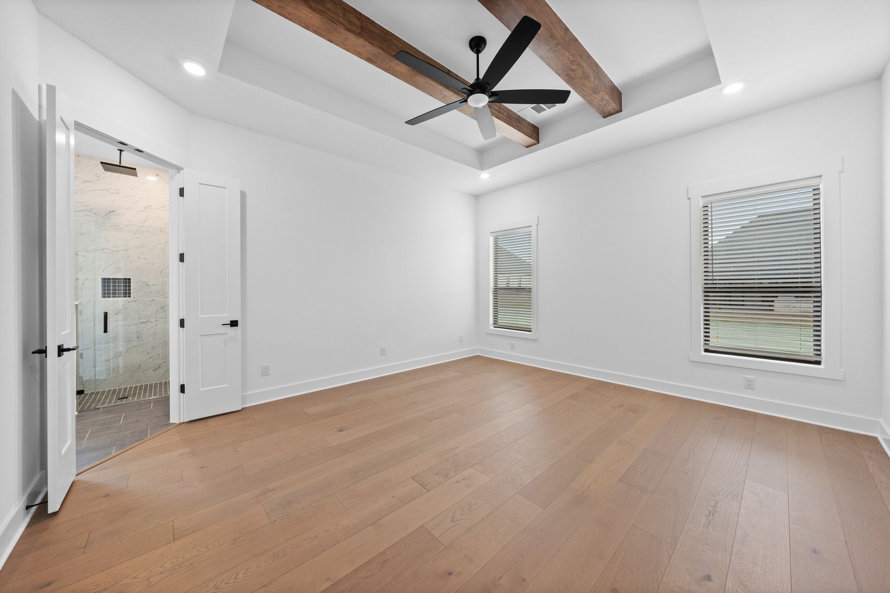 The formal dining room sits right off of the kitchen and has a large window.