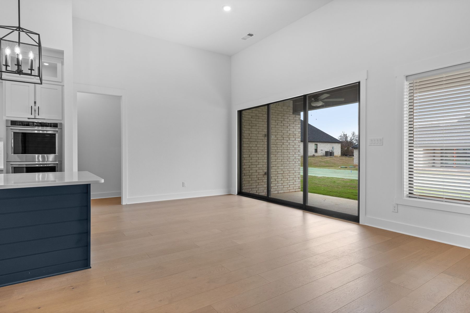 The open breakfast area has plenty of natural light from the sliding back doors.