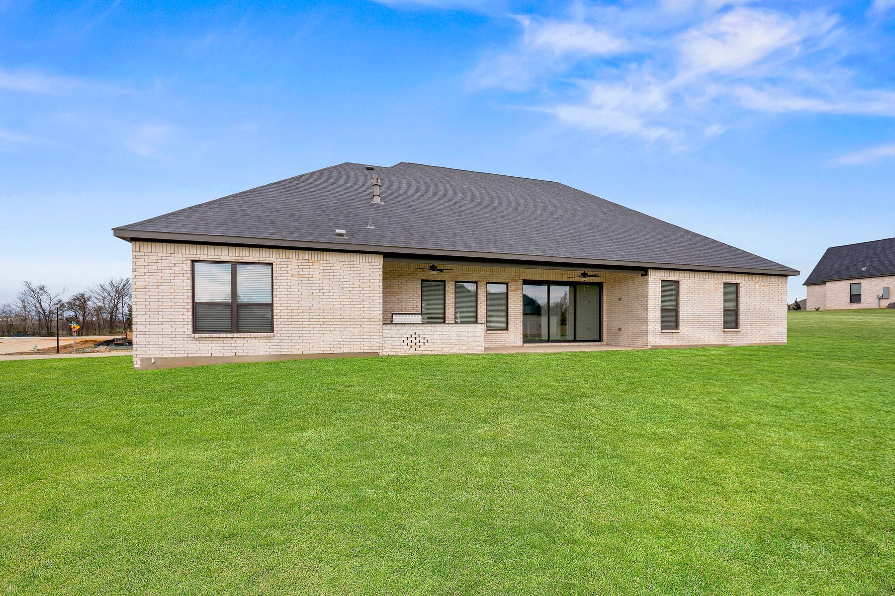 The Mantle II has a gorgeous back yard that includes a covered patio with an outdoor kitchen.