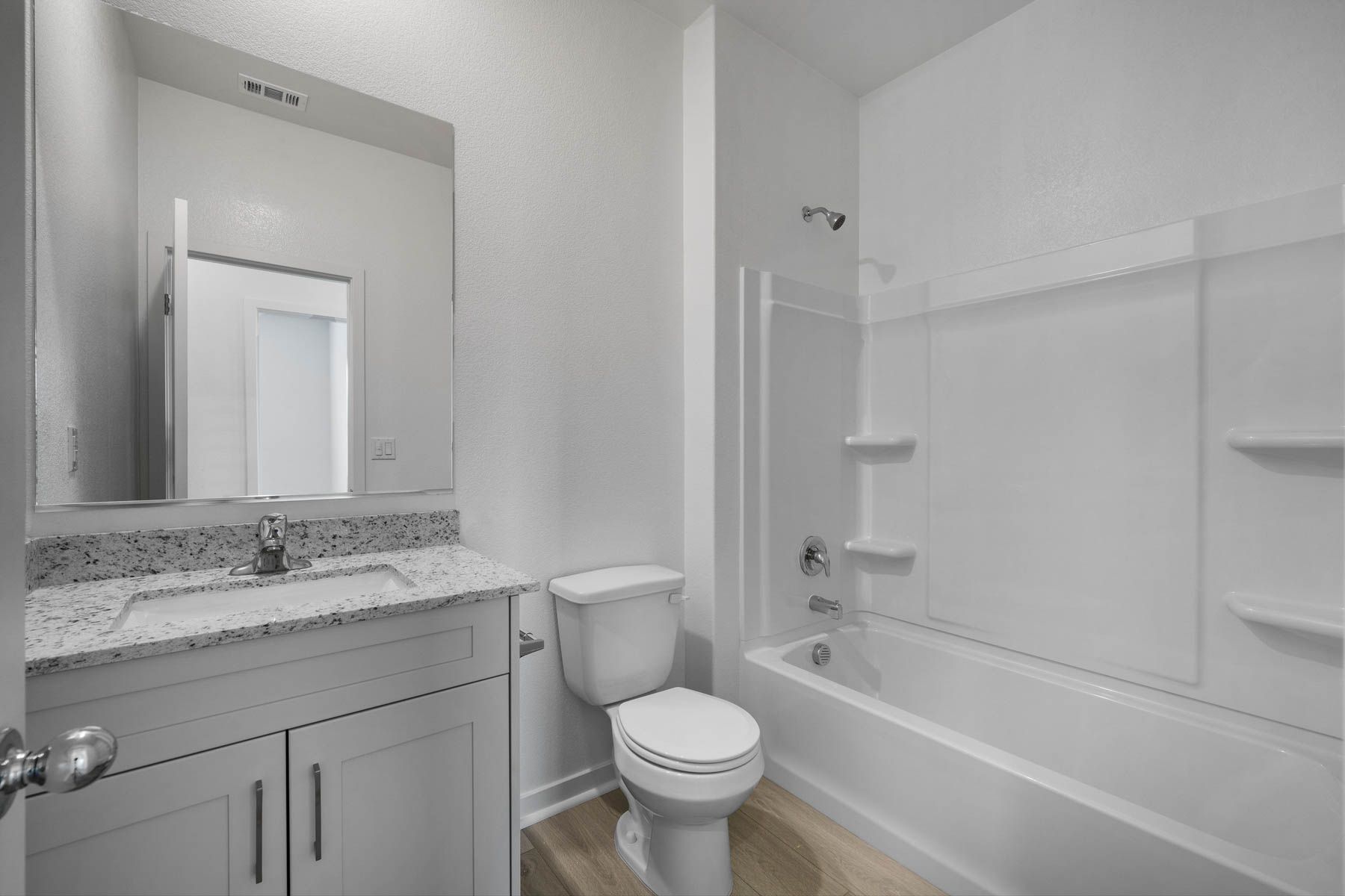 The secondary bathroom has tub/shower combo