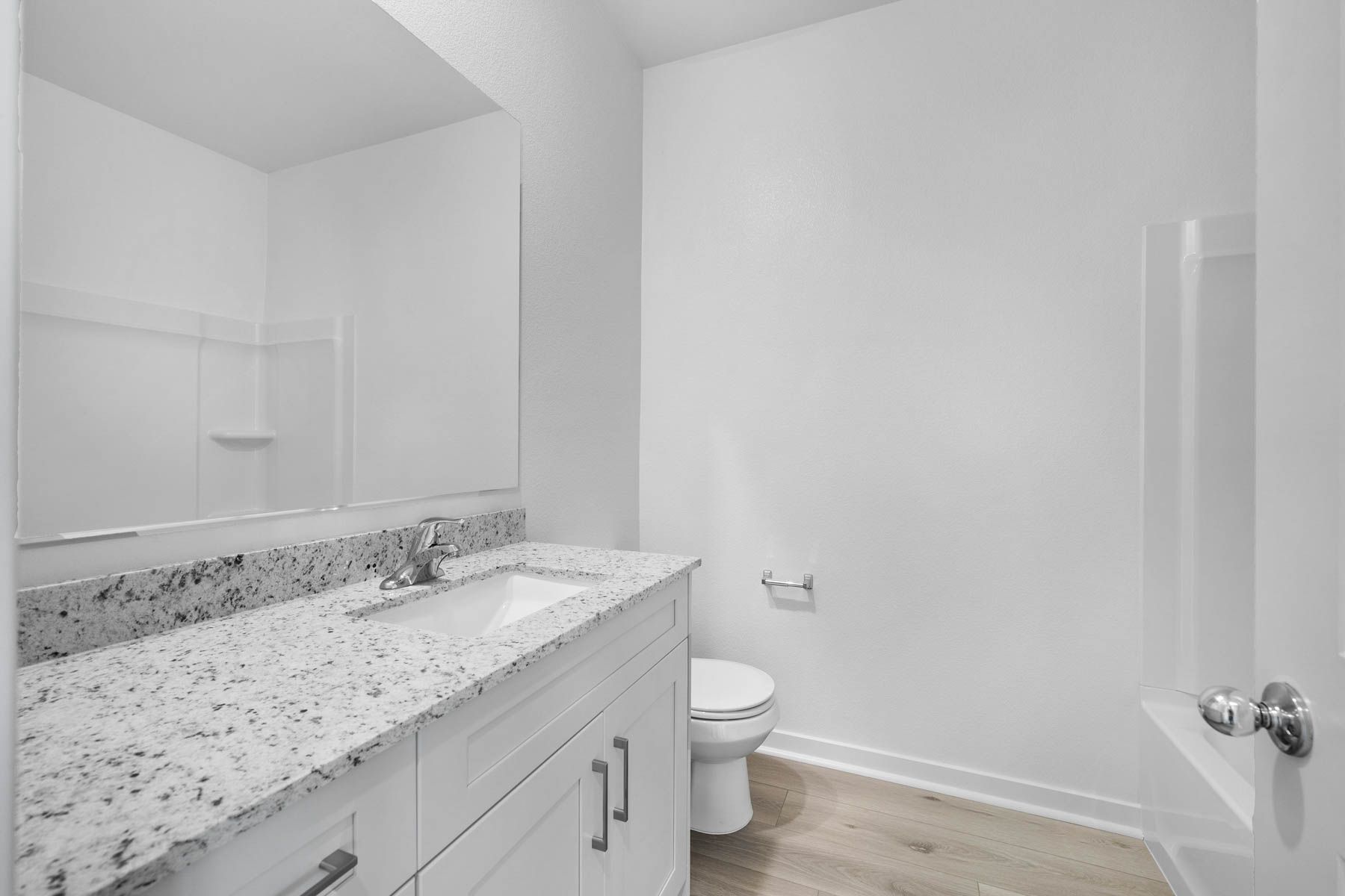 The secondary bathroom has a tub/shower combo.