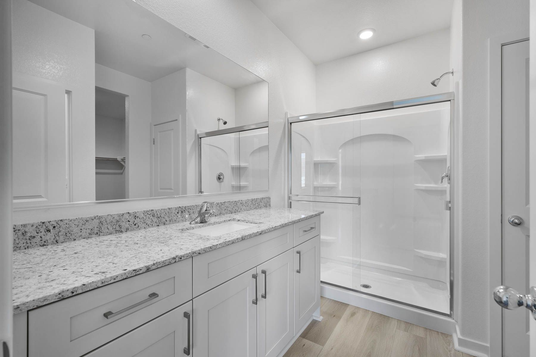 The master bathroom has a large vanity.