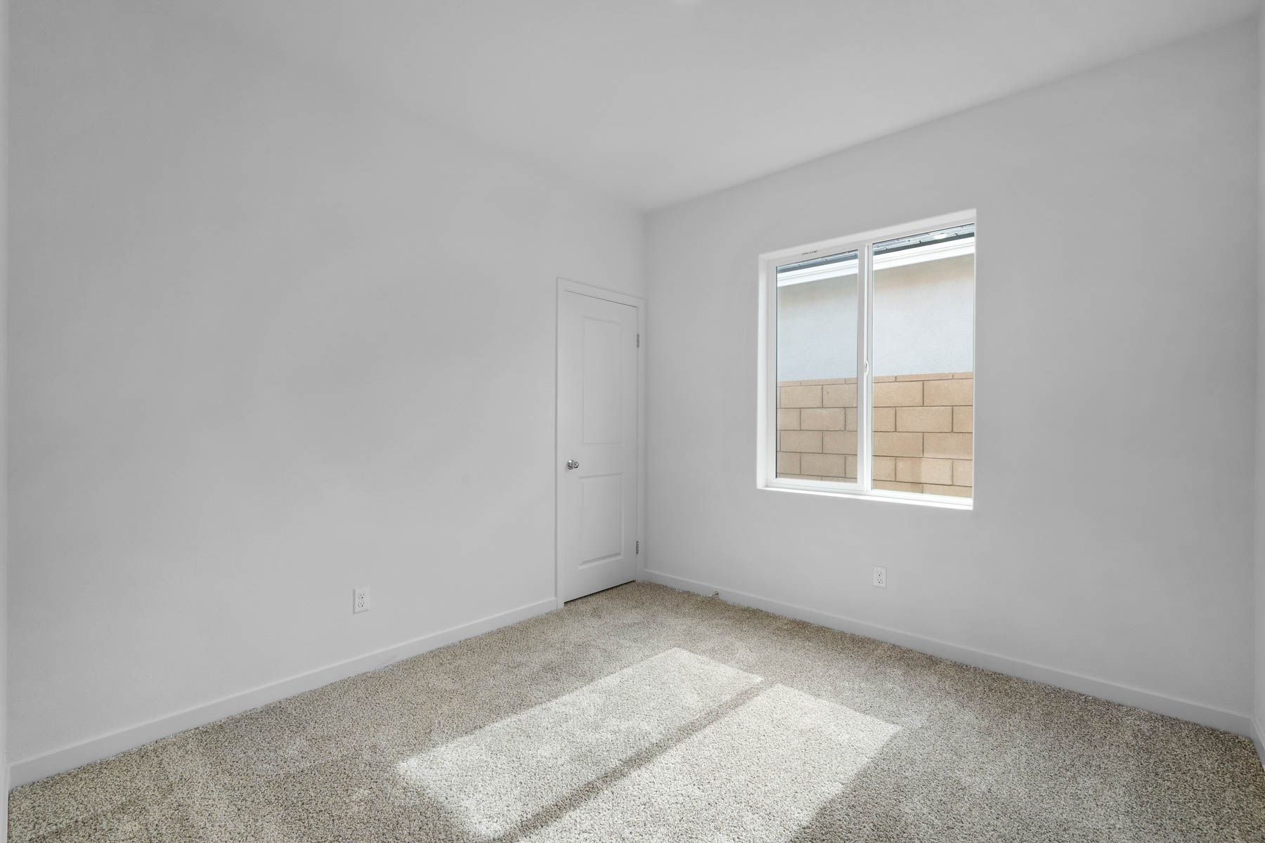 The secondary bedroom has carpet.
