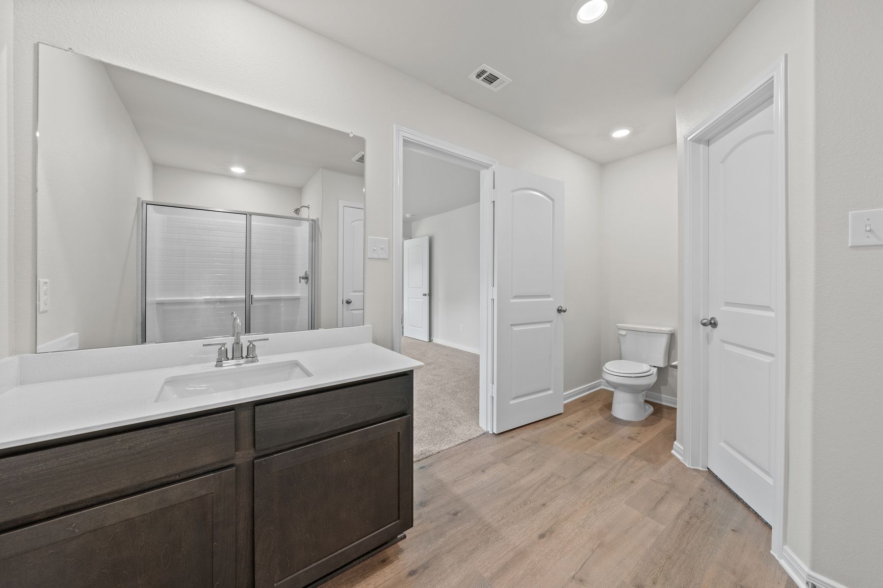 The master bathroom of the Cedar has a vanity with plenty of counterspace.