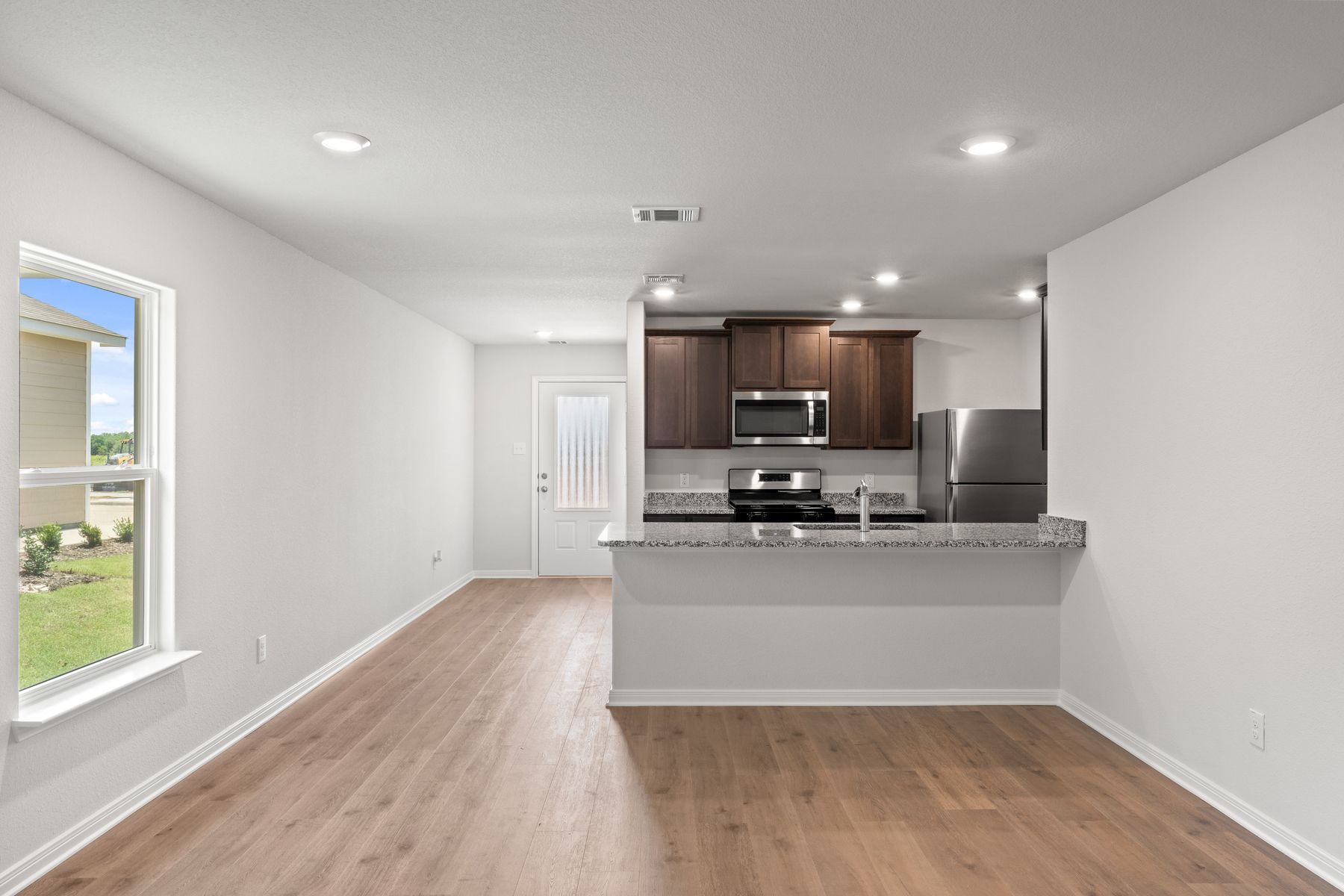 The dining room of the Cedar floor plan sits just off of the kitchen.