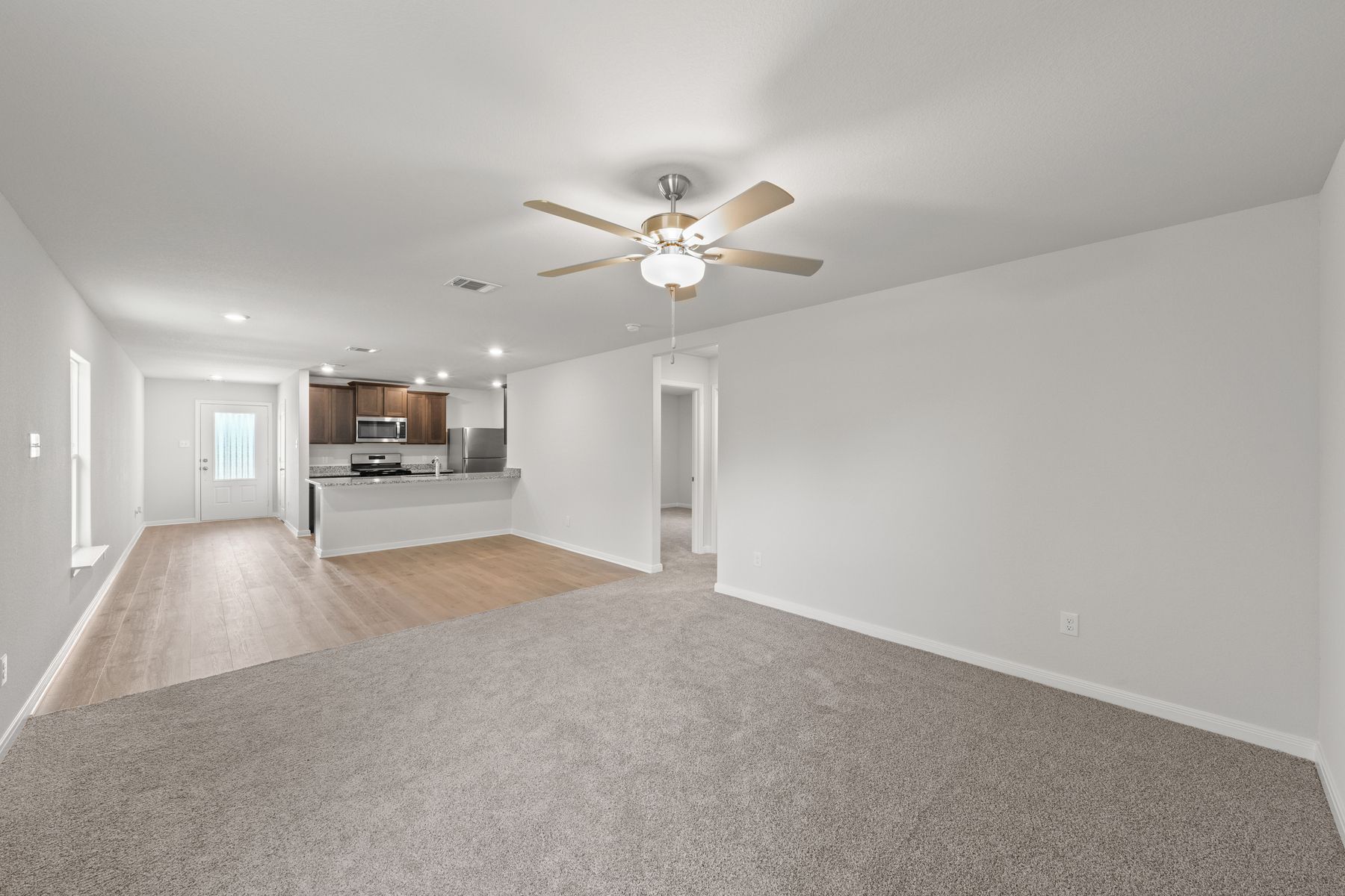 The family room of the Cedar sits right off of the dining area.