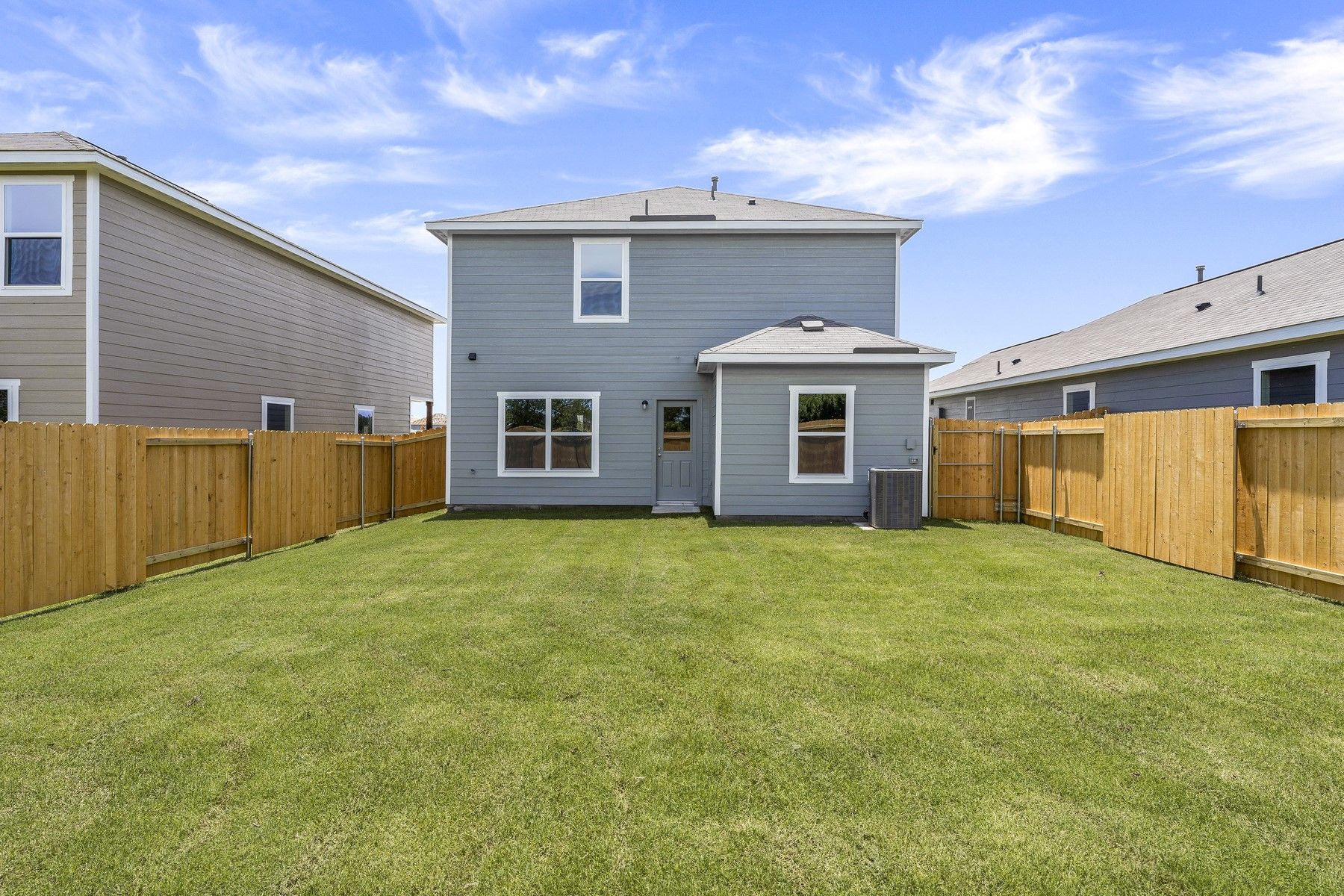 The back yard of the Colorado floor plan is fully fenced-in.