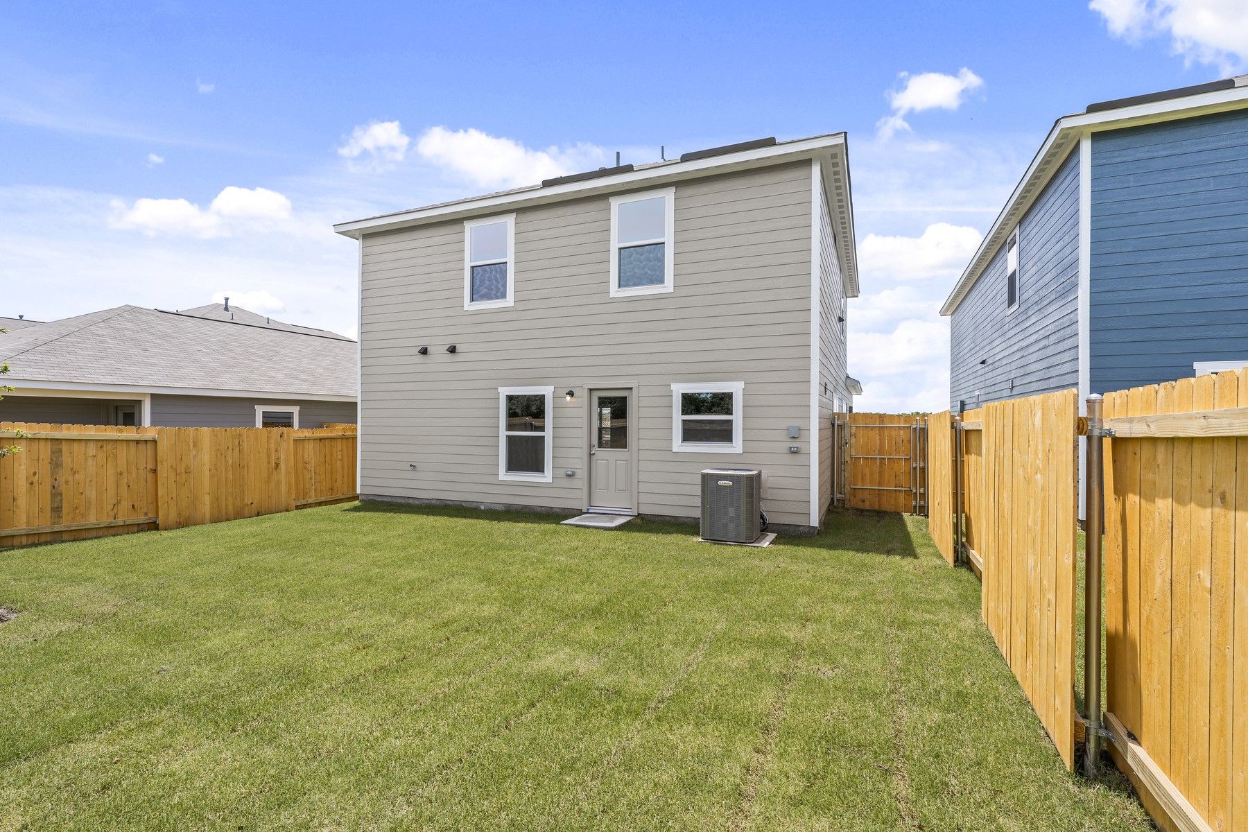 The back yard of the Piper is fully fenced-in.