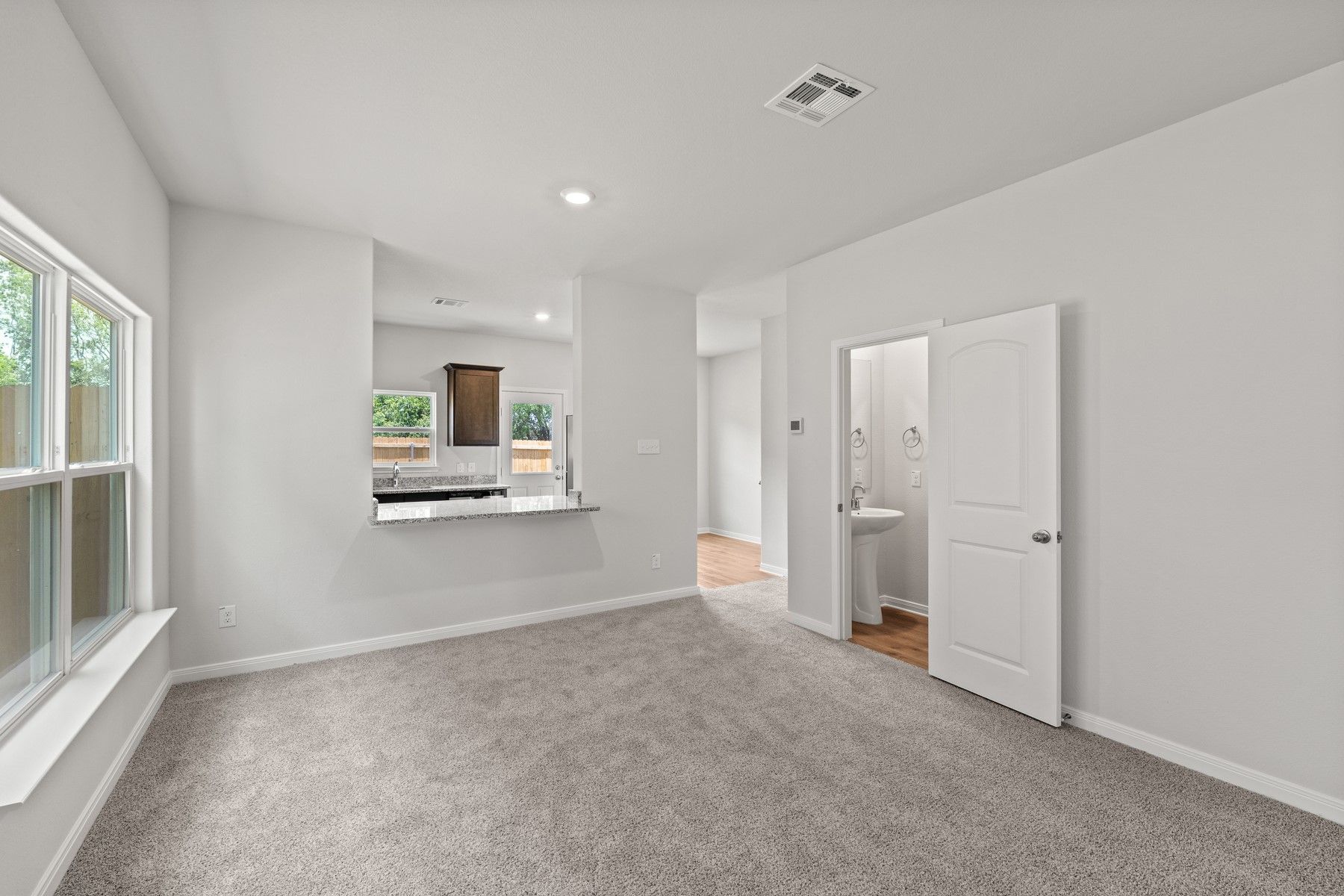 The main floor of the Piper floor plan has wonderful, open living spaces and a powder room.
