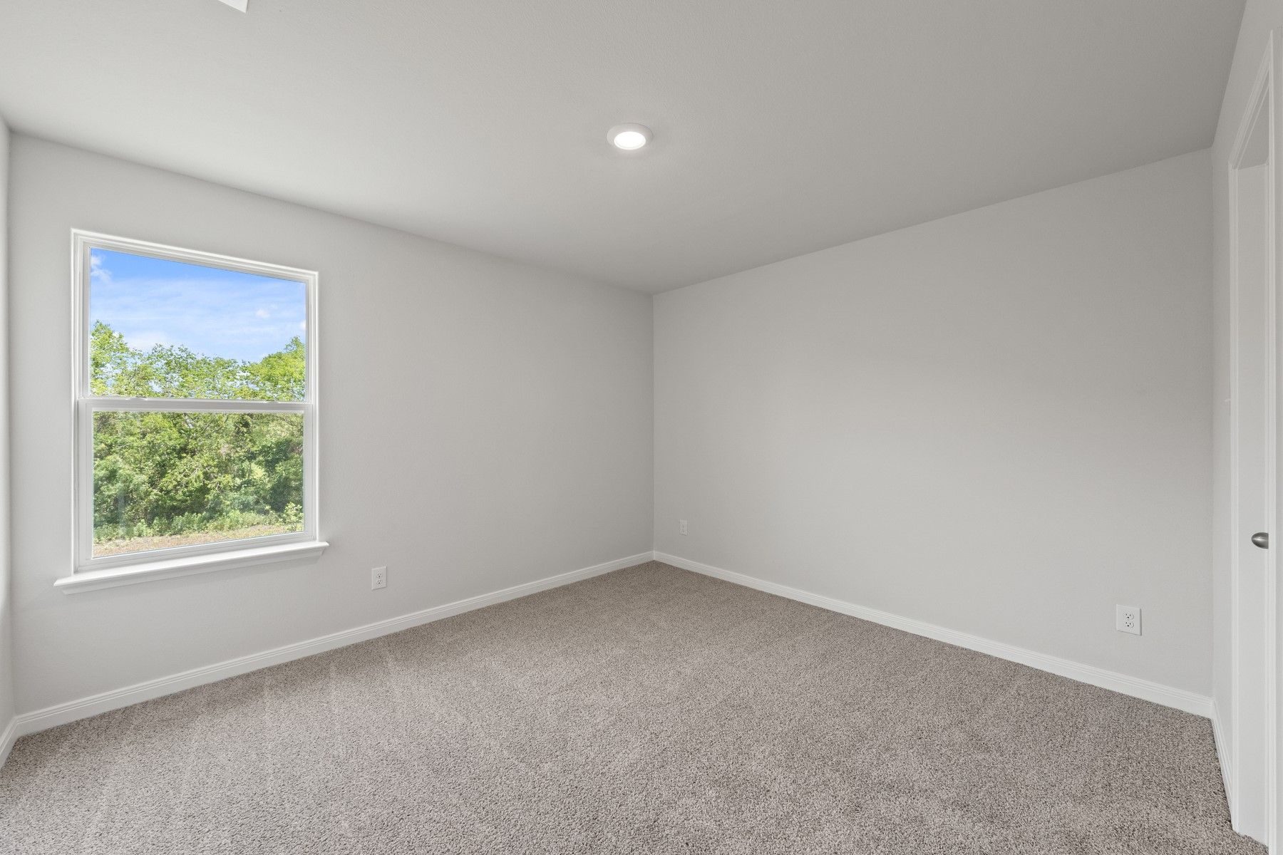 The secondary bedrooms of the Piper plan are the perfect space for a child's bedroom or a guest room.