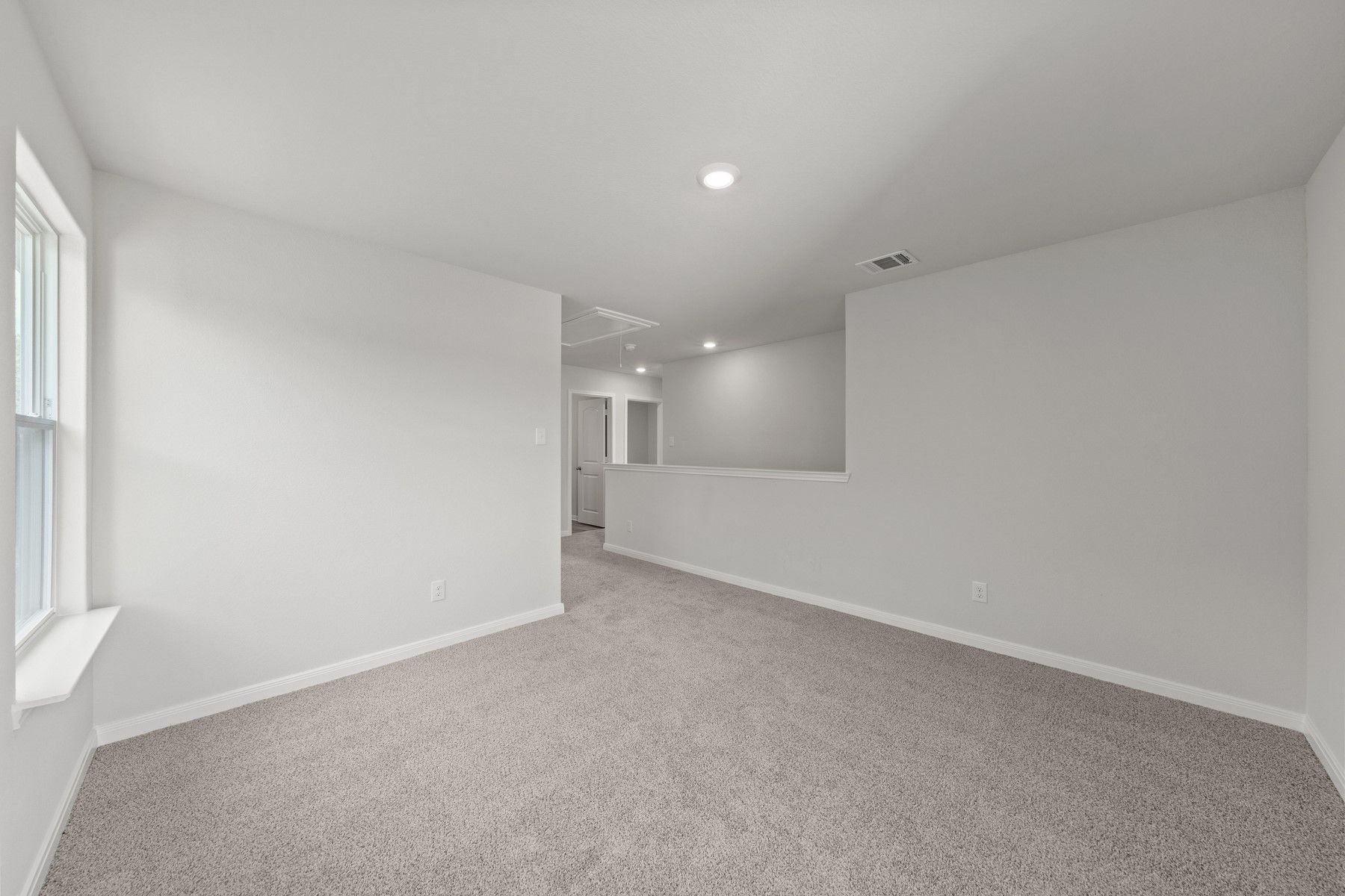 The spacious upstairs loft is the perfect space for a gameroom, playroom or craft space.