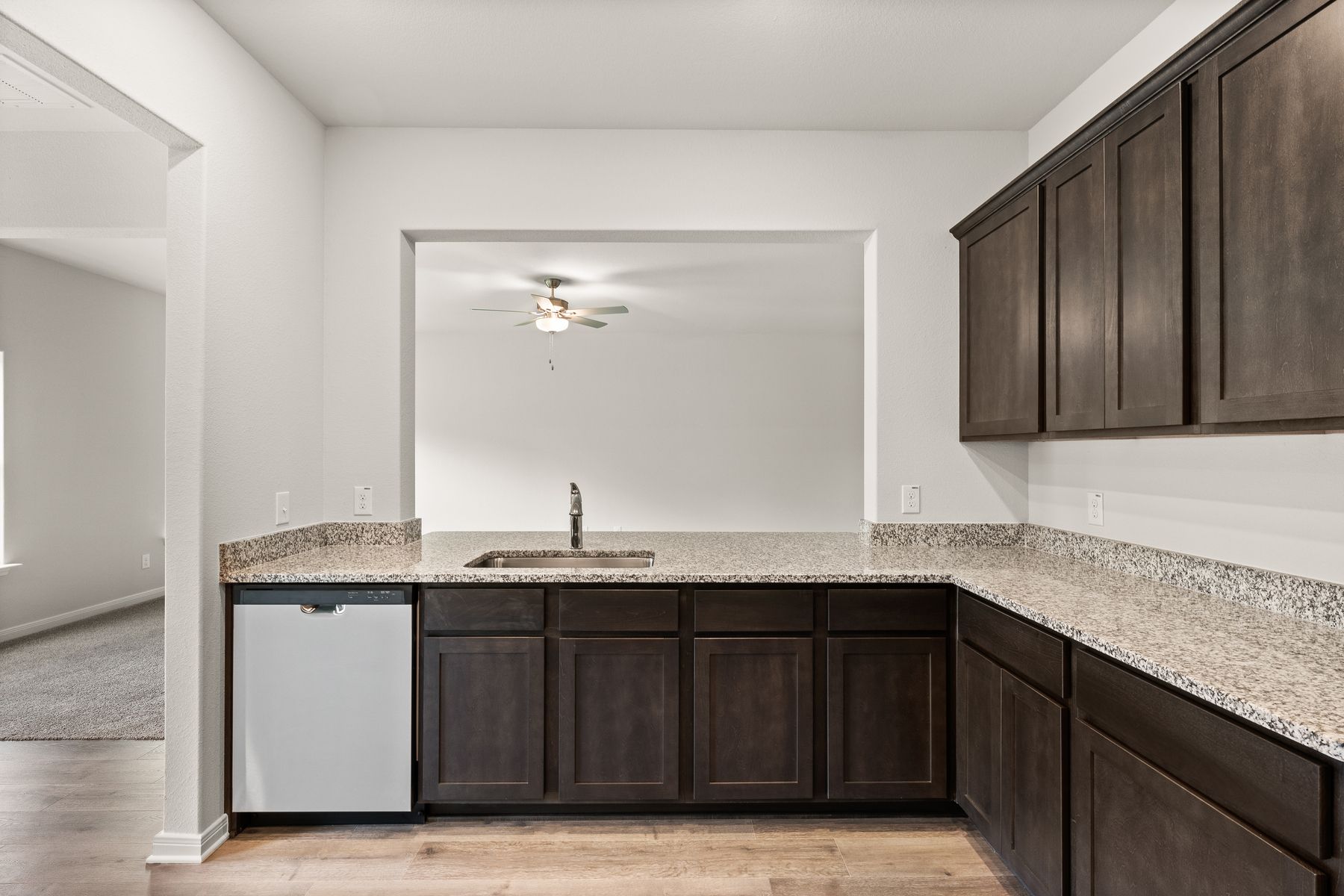 The kitchen of the Rayburn looks out into the family room.