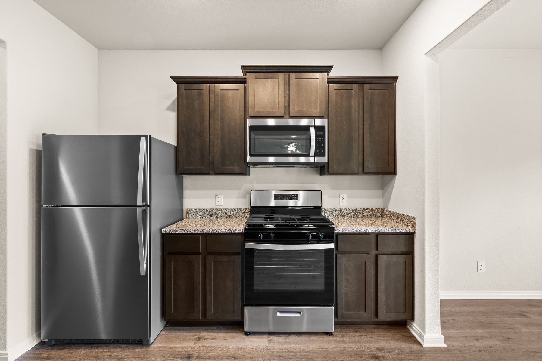 The kitchen of the Rayburn has gorgeous wood cabinetry.