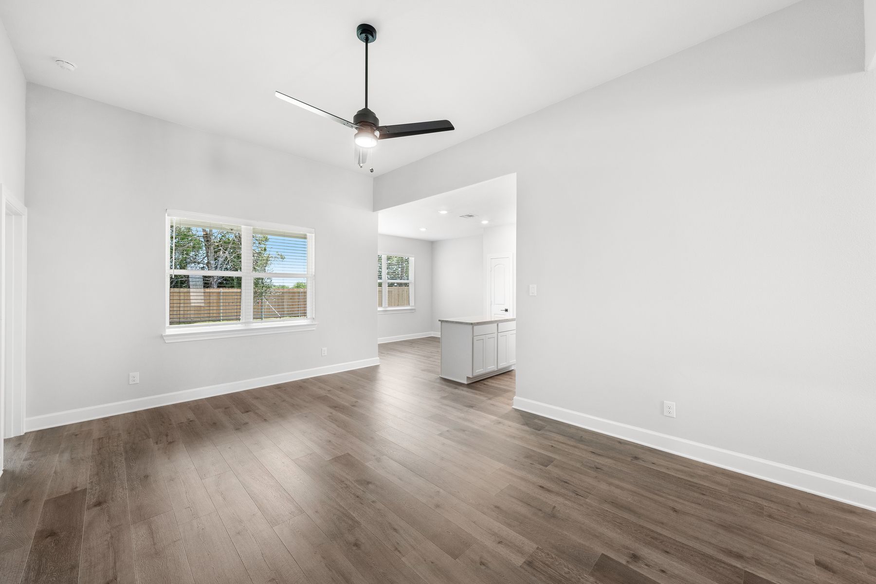 The large windows in the family room of the Blanco let in great natural light and backyard views.
