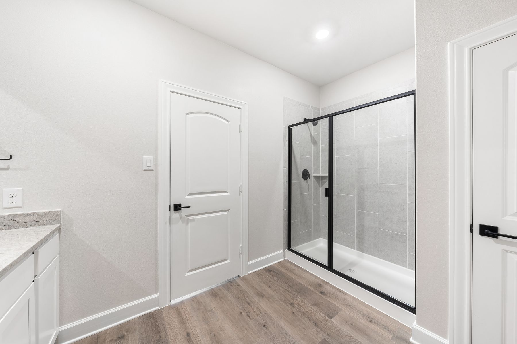 The master bathroom of the Blanco has a glass, walk-in shower.