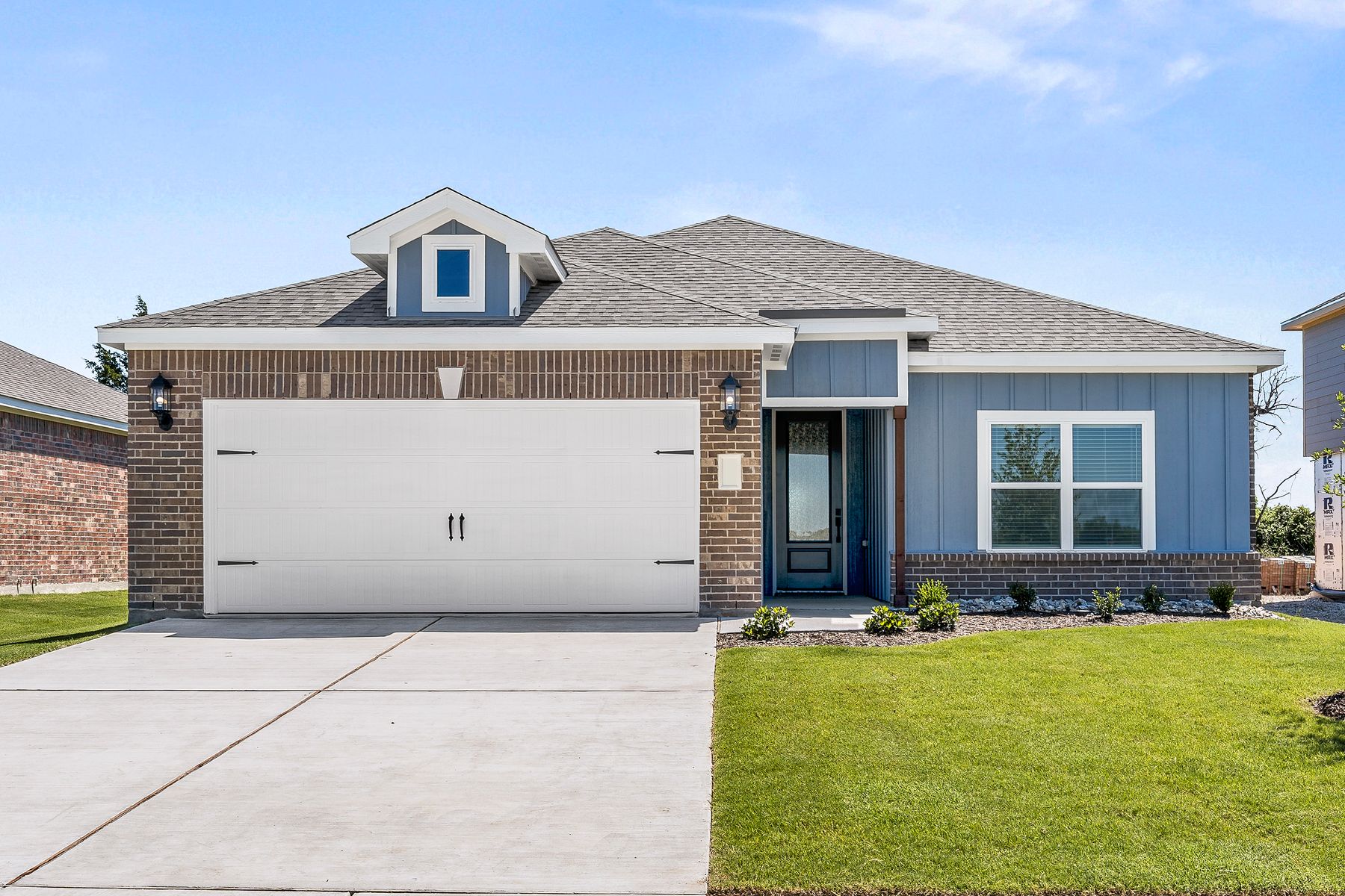 The one-story Rio Grande floor plan has a beautiful brick and siding exterior.