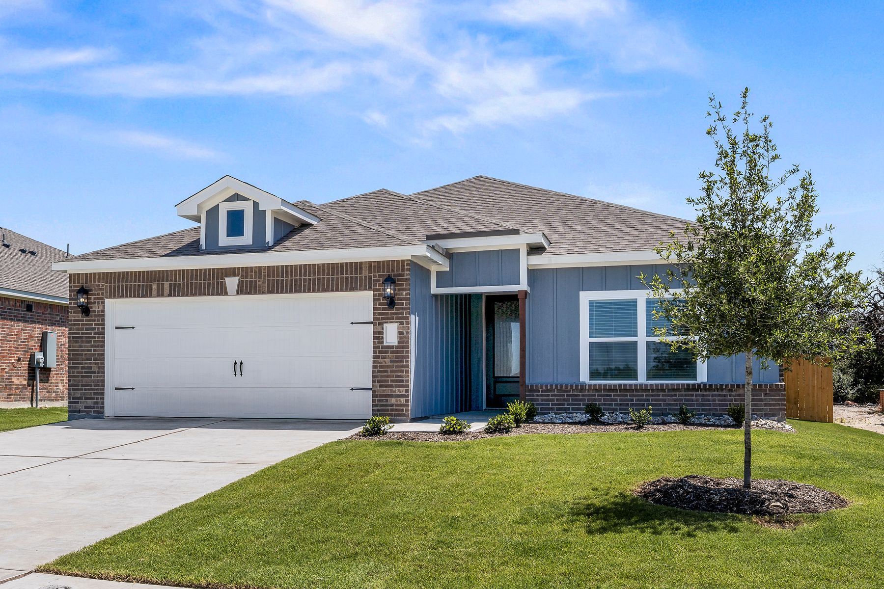 The one-story Rio Grande floor plan has a beautiful brick and siding exterior.