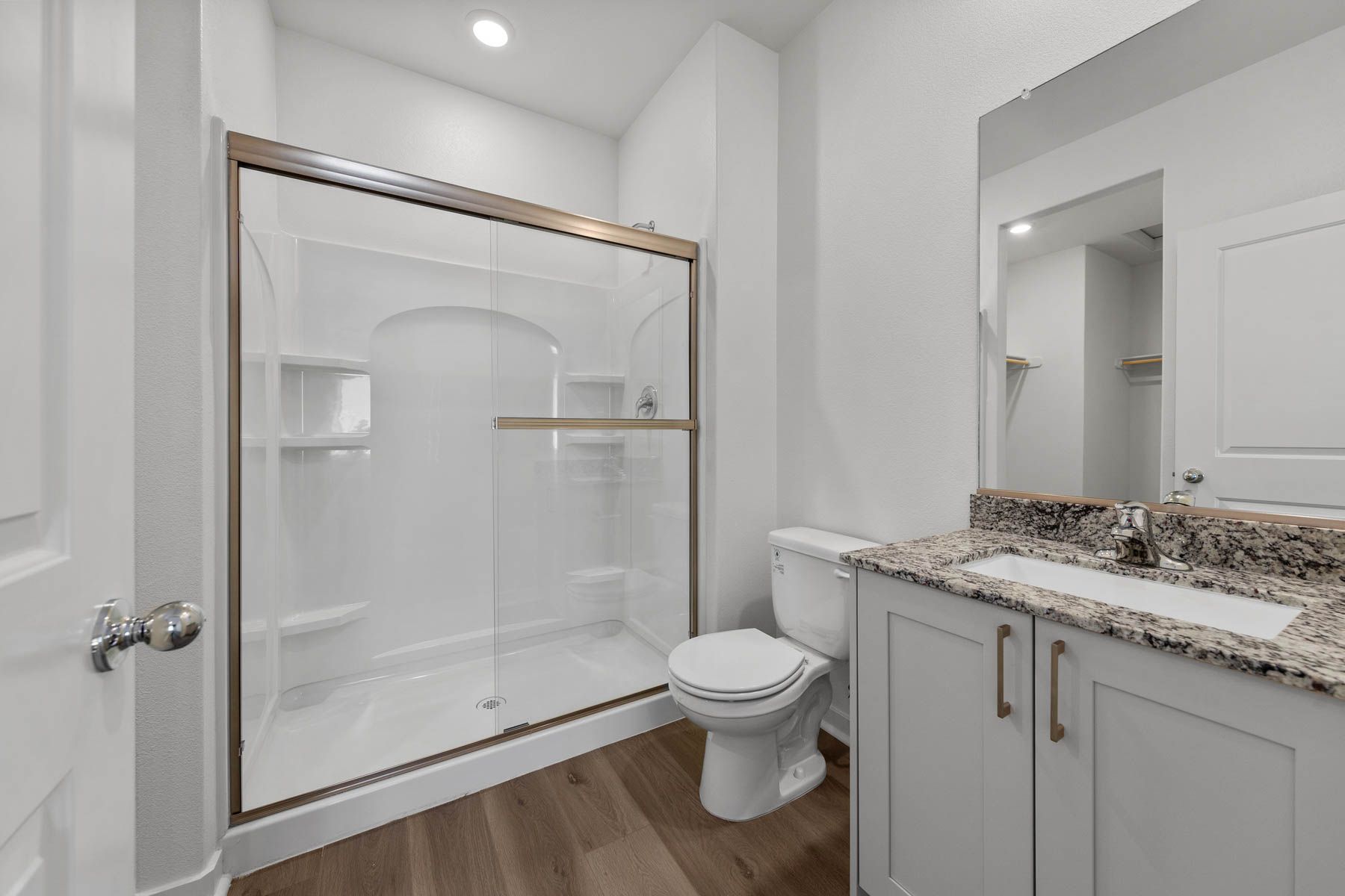 The master bathroom has a large vanity.