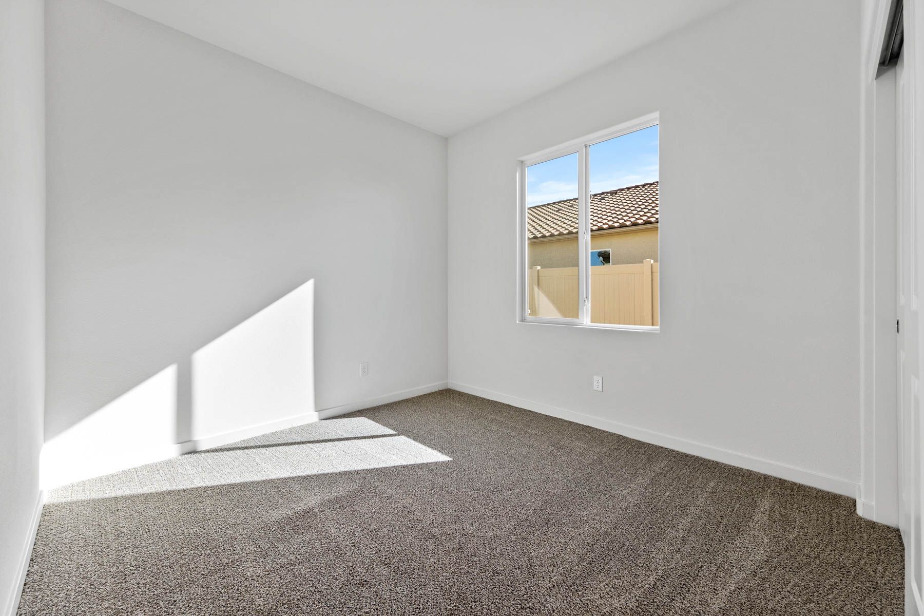 The secondary bedroom has carpet. 