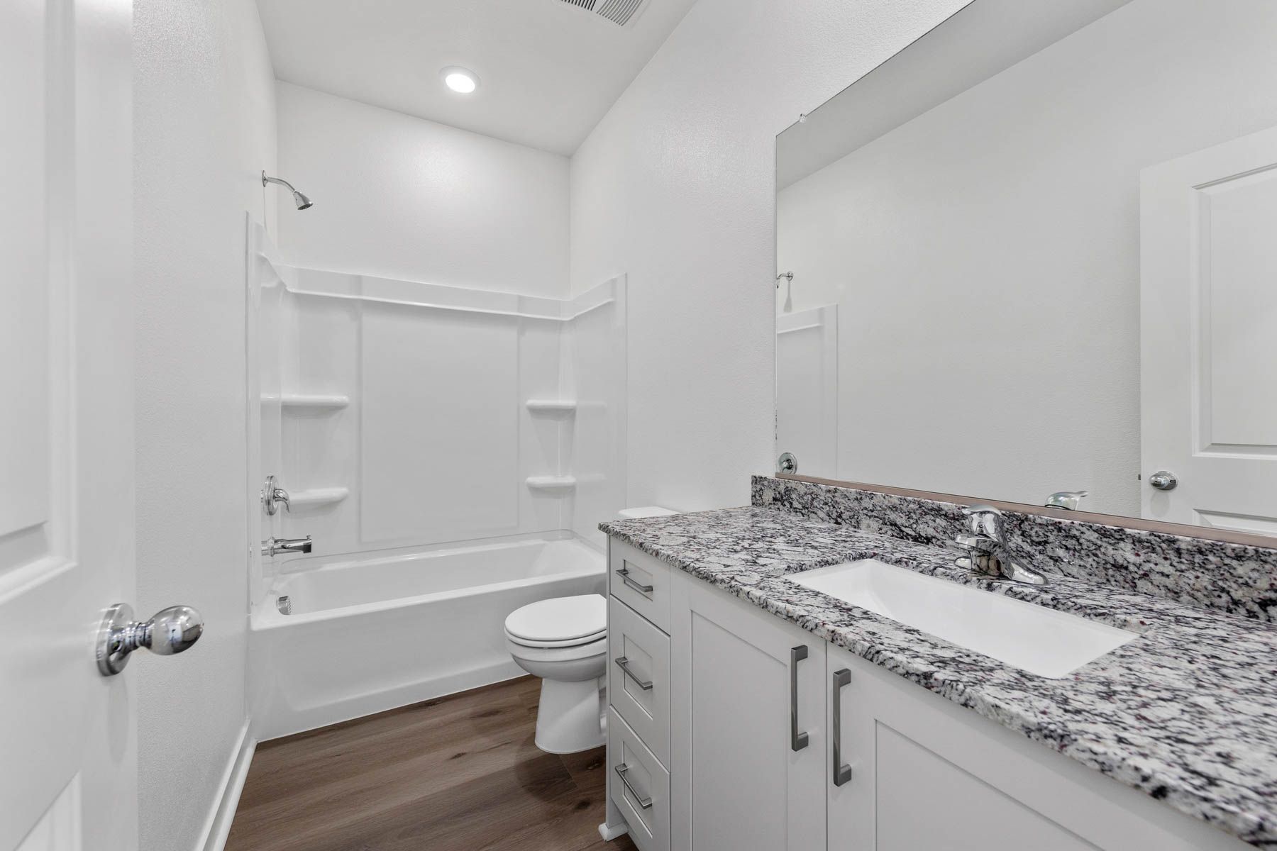 The secondary bathroom has a tub/shower combo.